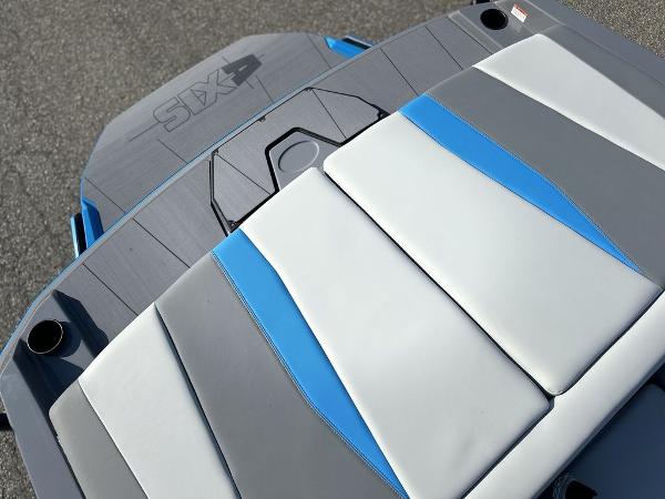 2025 Axis A225 boat with gray and blue cushioned seating.