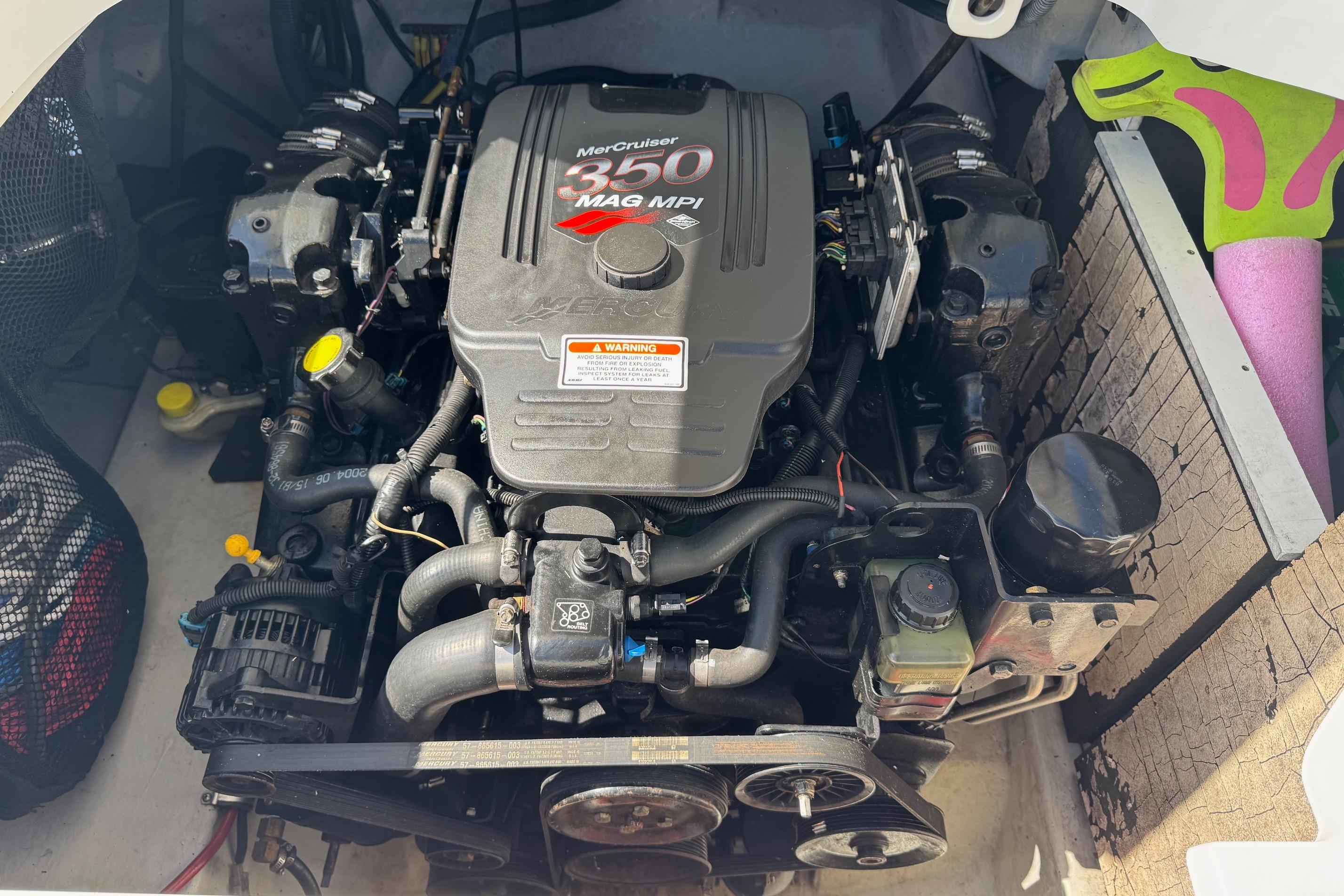 Engine compartment of a 2005 Cobalt 240 boat with MerCruiser 350 MAG MPI engine.