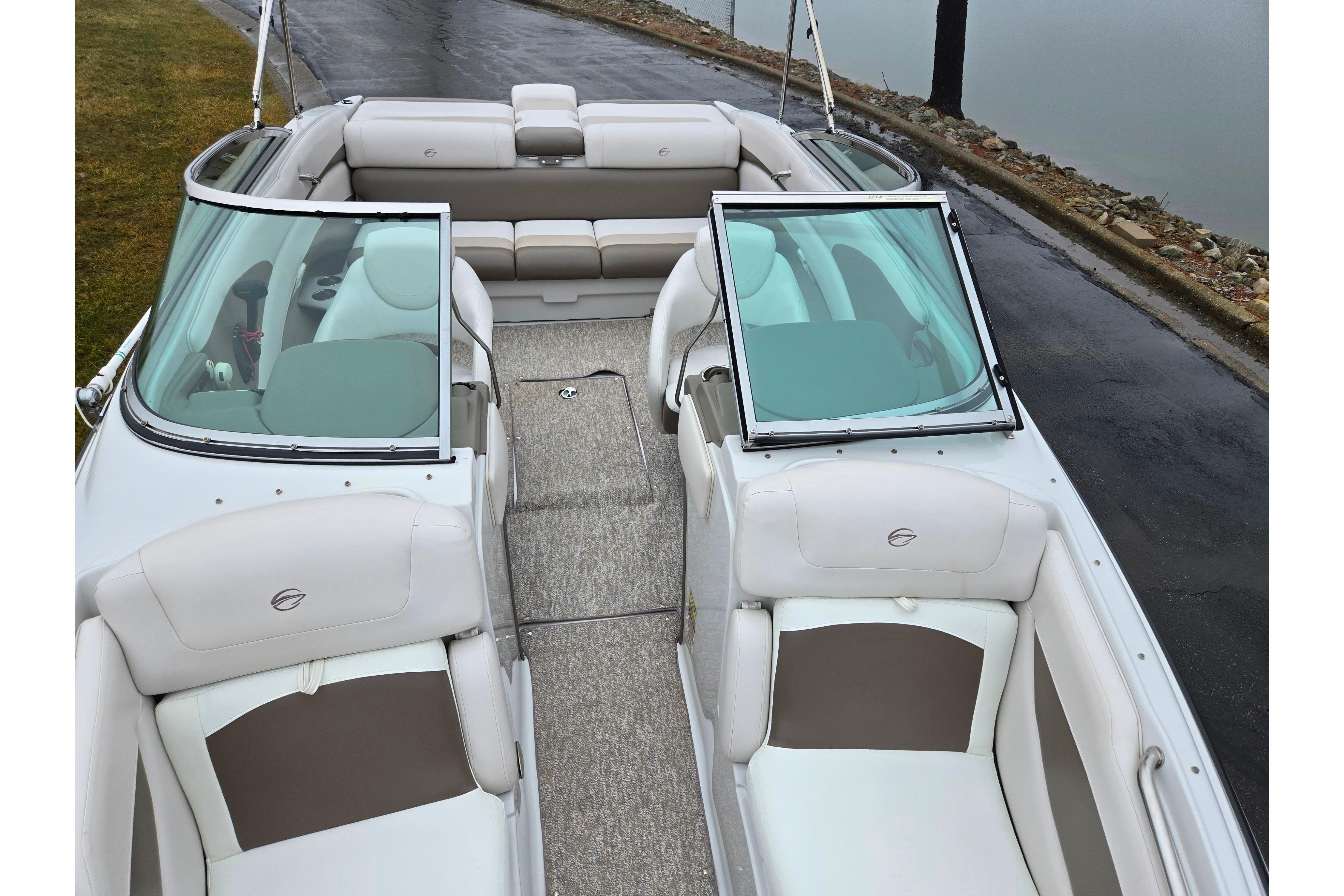 2012 Crownline 235 SS boat interior with beige seating and open windshield.