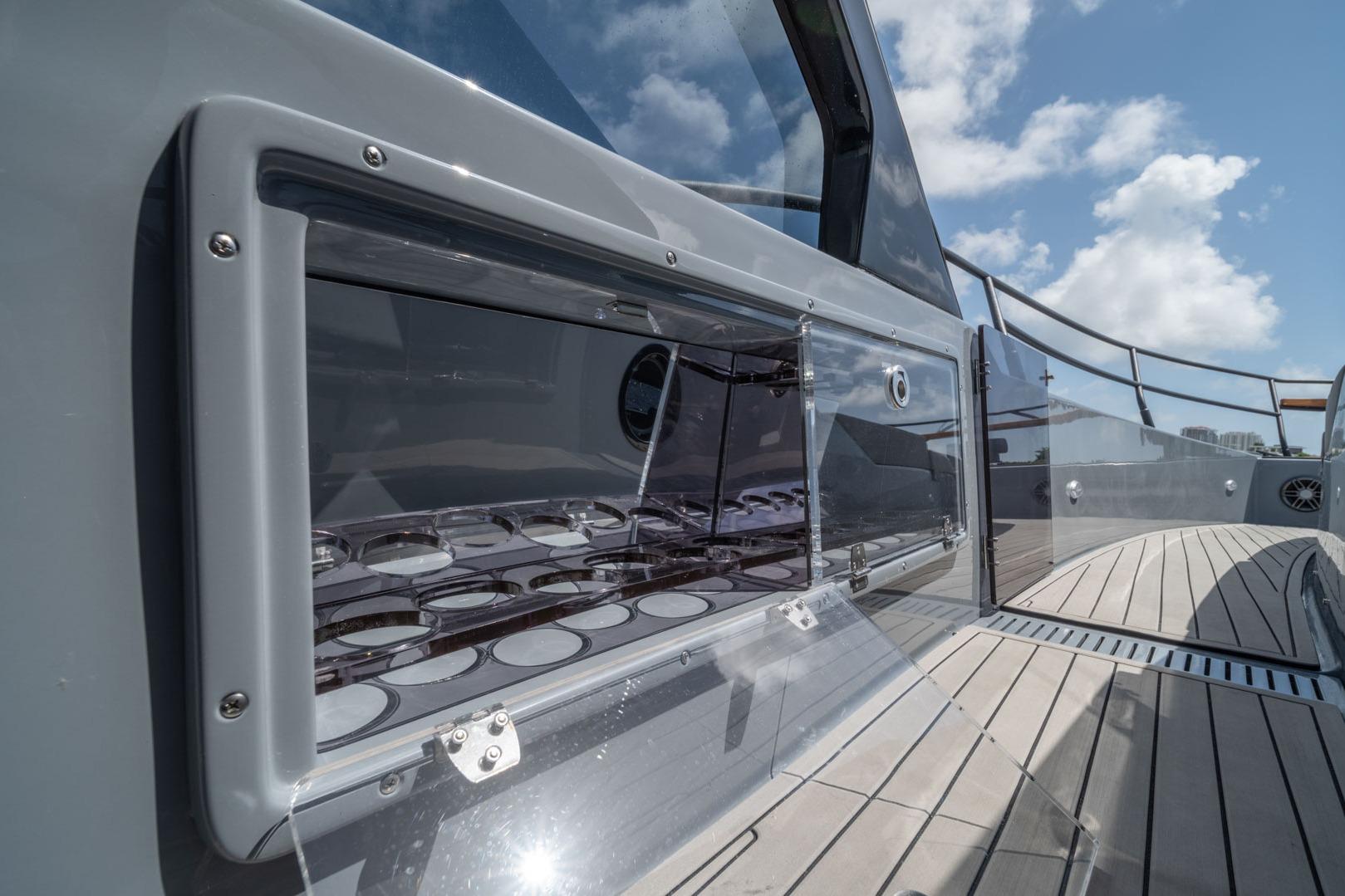 Modern Hanover 387 yacht deck with sleek design, glass panels, and clear blue sky, 2026 model.