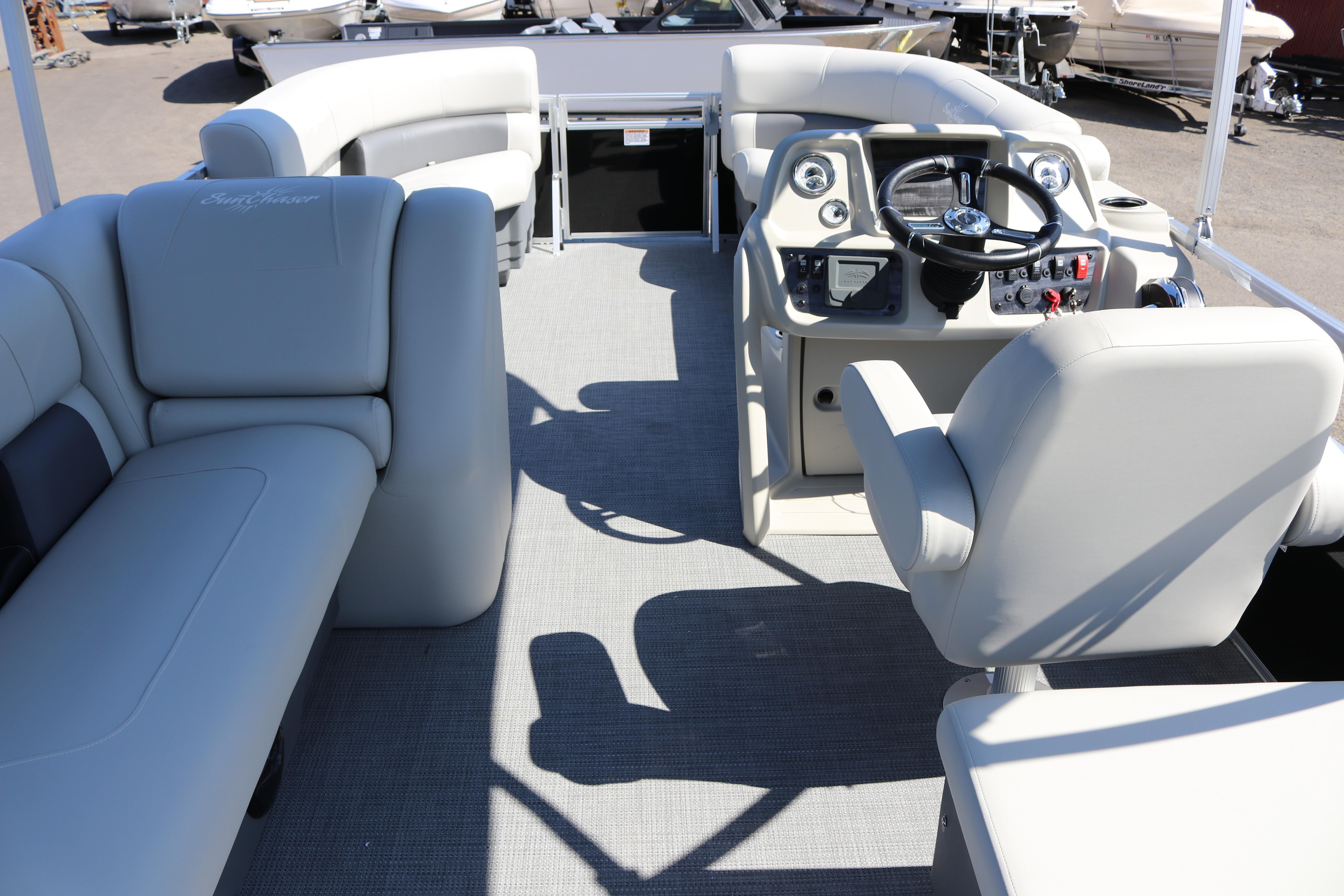 2025 SunChaser Vista 20 Fish pontoon boat interior with plush seating and modern helm.