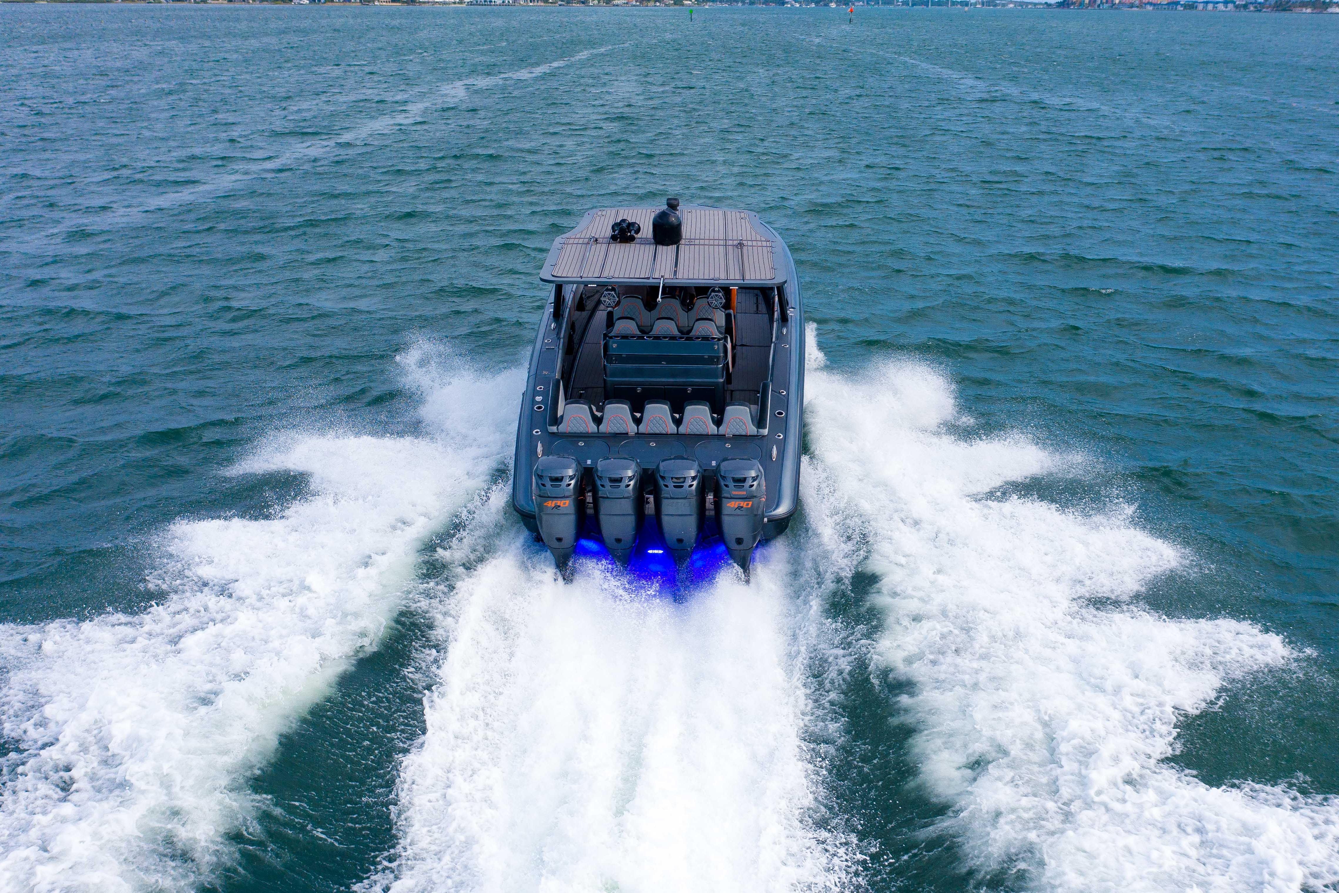 2019 Midnight Express 43 Open speeding on open water, showcasing powerful engines and sleek design.