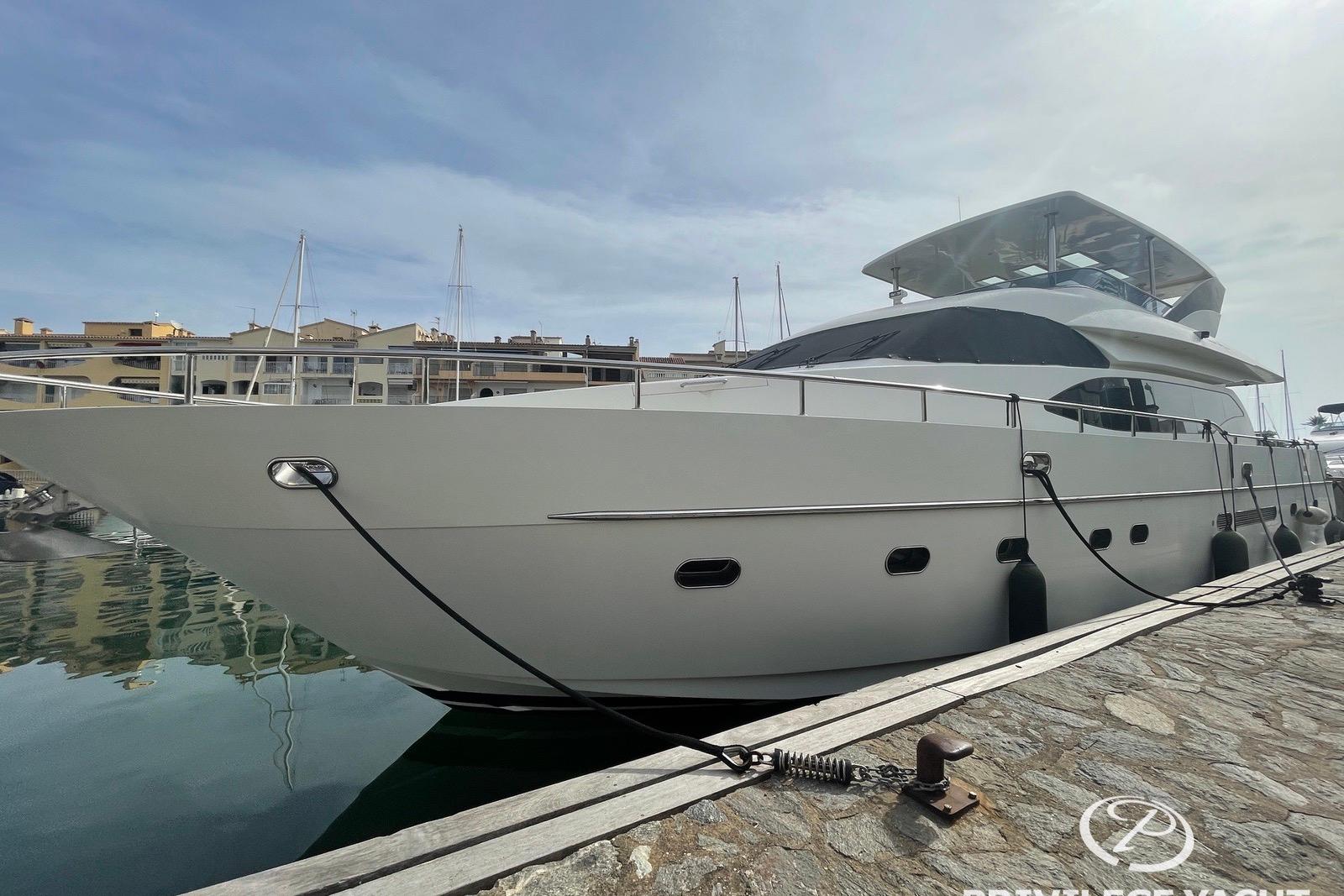 Luxury 2006 Monte Fino 76 yacht docked at marina under clear sky.