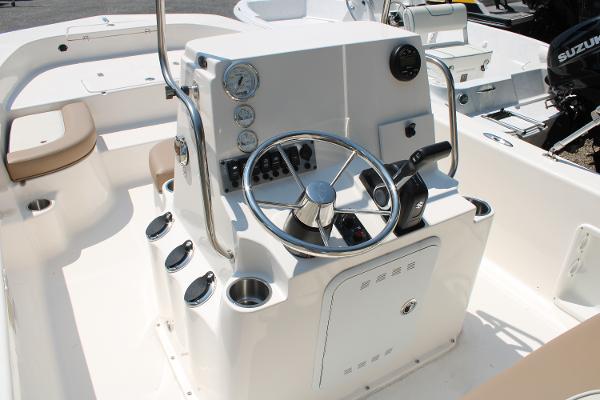 2023 Sundance DX20 boat interior with steering console and gauges.