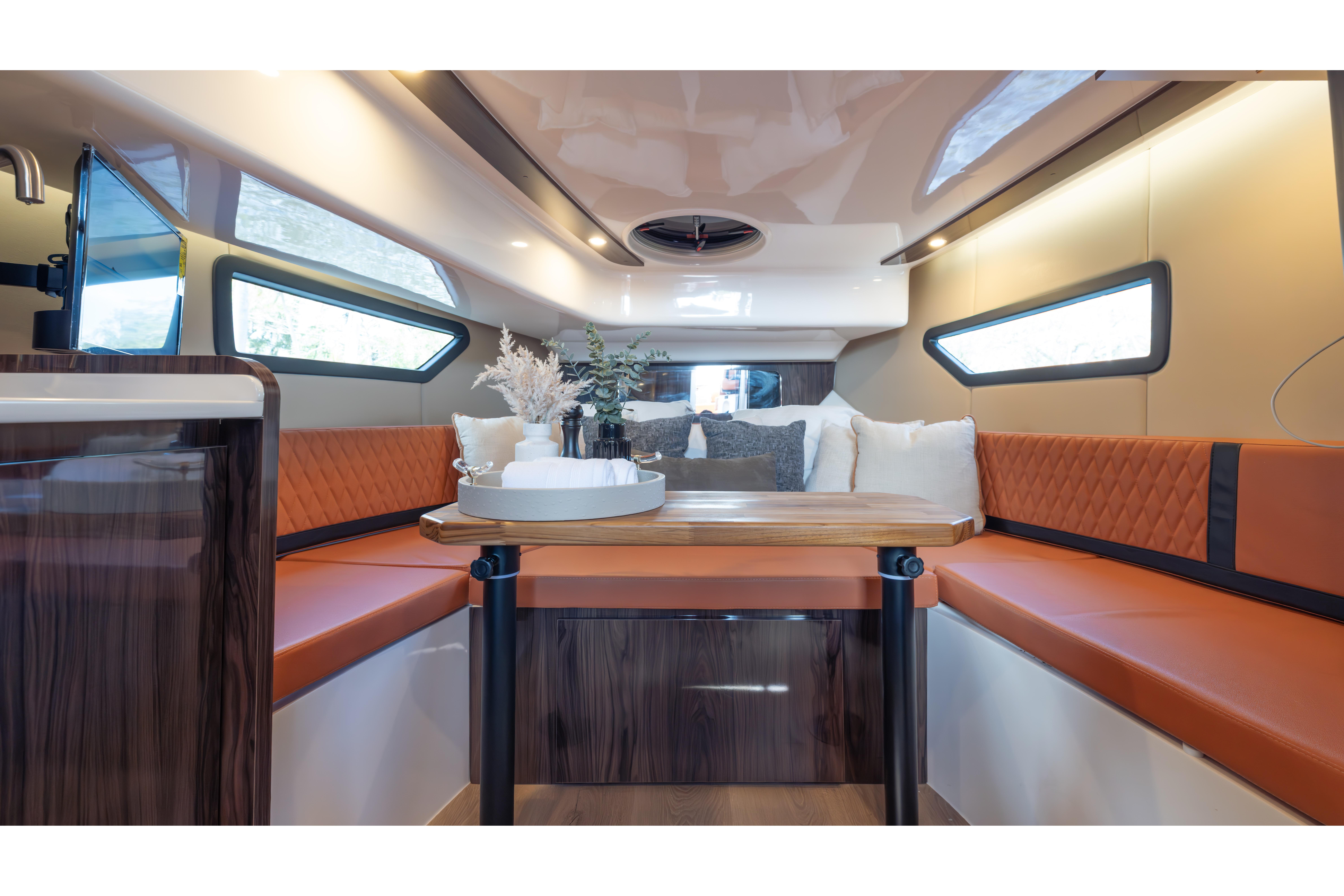 Luxurious interior of 2026 Hanover 387 yacht with elegant seating and modern decor.