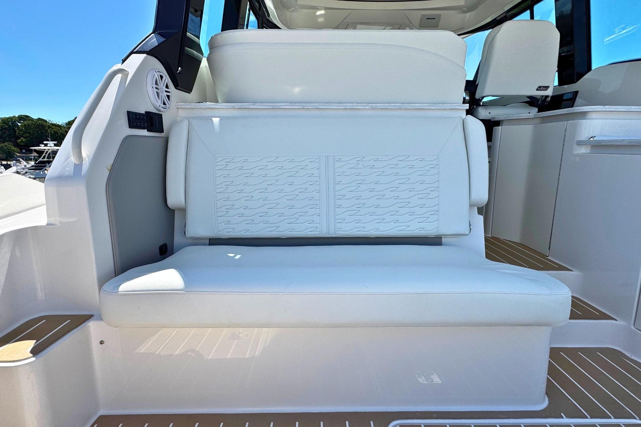 Luxury seating on 2027 Tiara Yachts 39 LE, featuring elegant white upholstery and modern design.