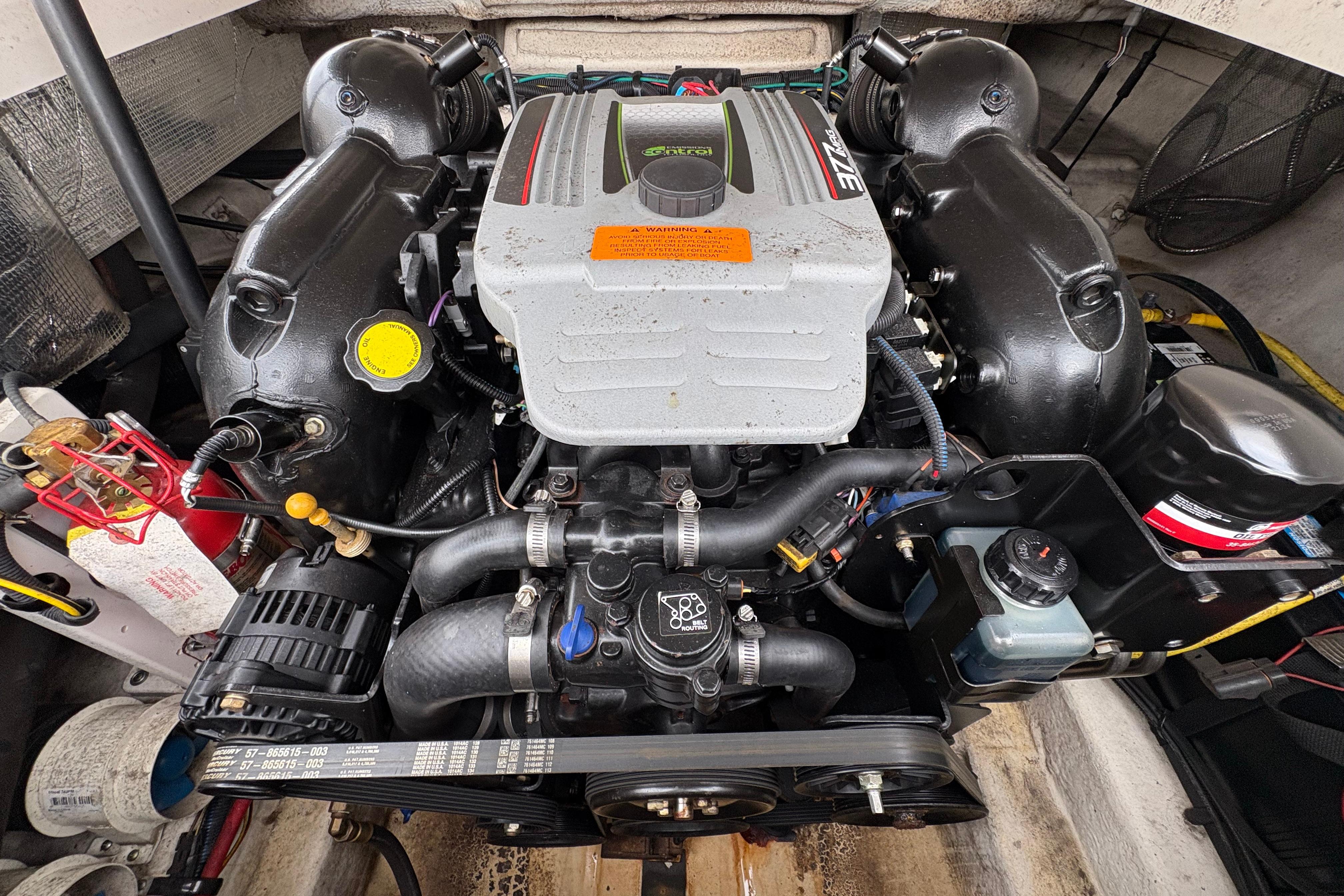 Engine of a 2015 Chaparral 264 Sunesta boat, showcasing detailed components.