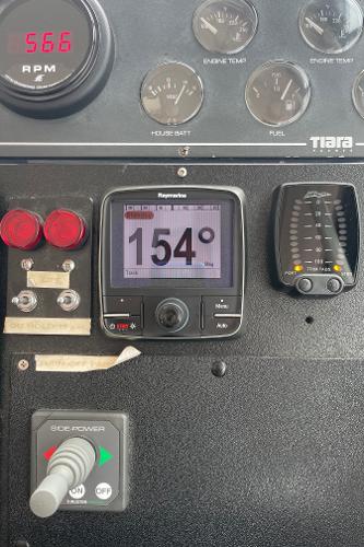 Dashboard with various gauges and controls on a 2003 Tiara Yachts 3500 Open.