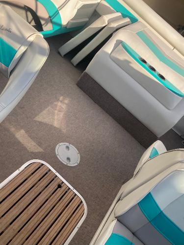 Interior of a 1992 Regal Valanti 200 boat with turquoise seating.