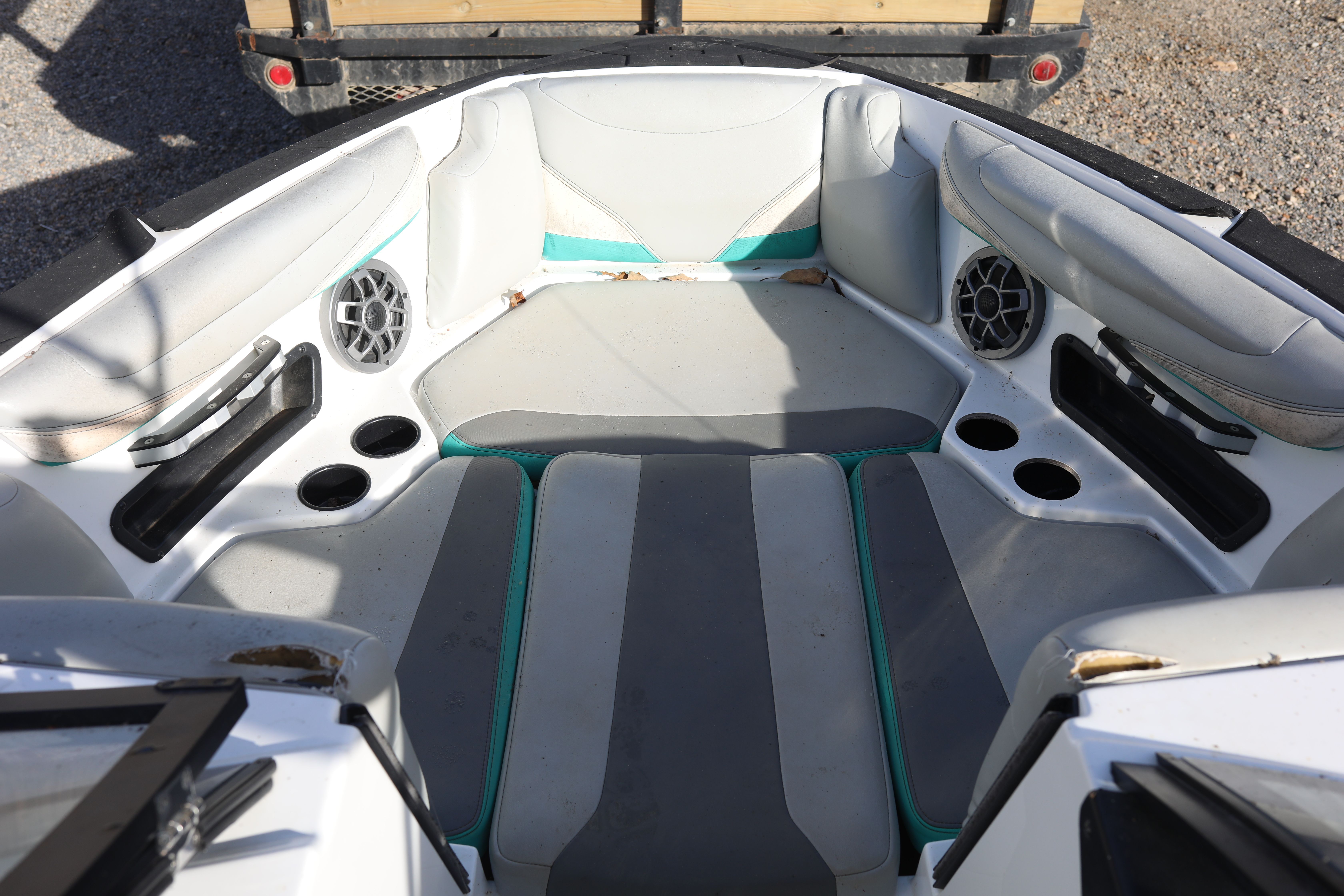 Interior of a 2019 Axis T22 boat with speakers and cup holders.