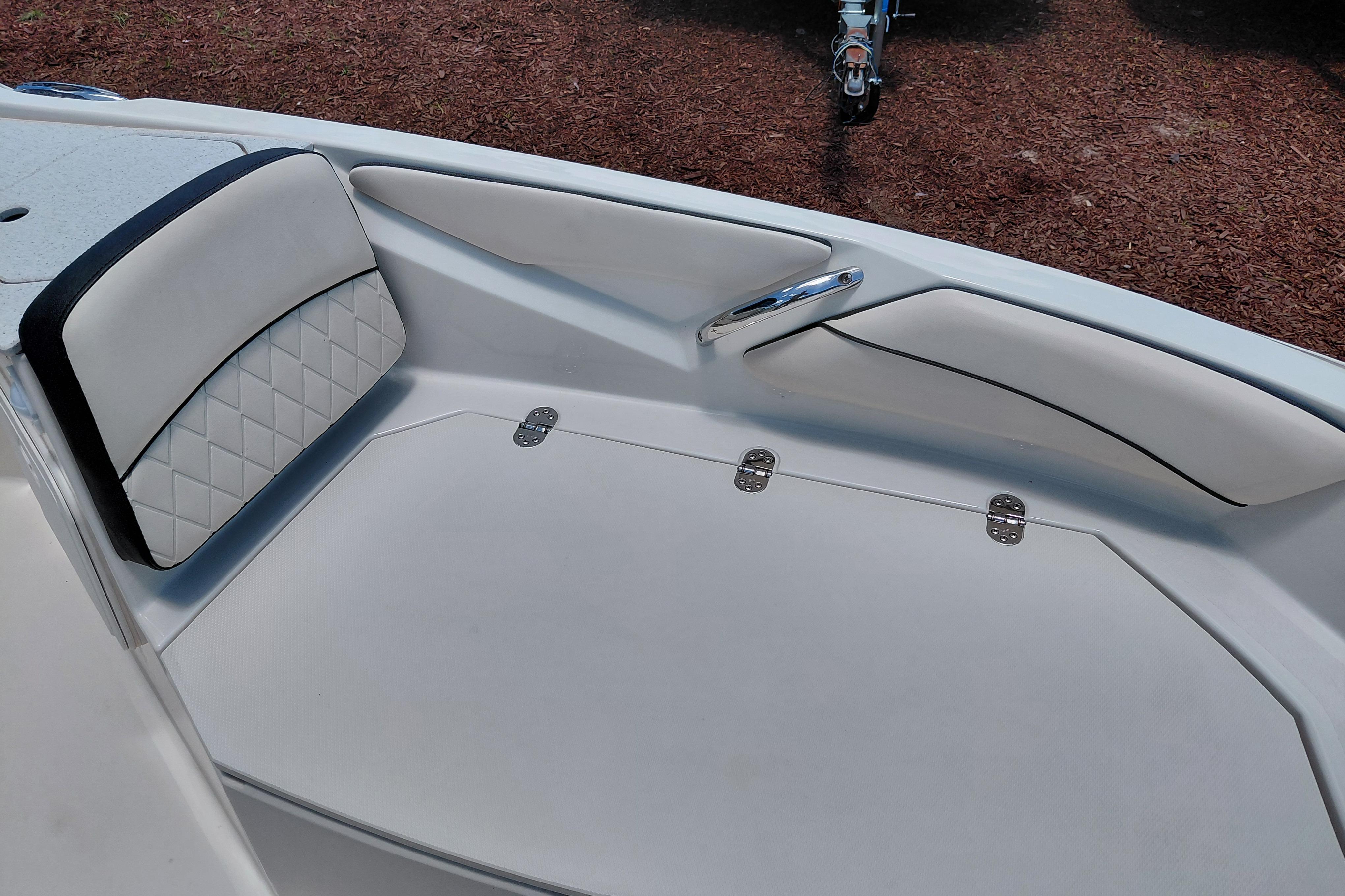 2023 Stingray 206 CC boat interior with cushioned seating and storage compartments.