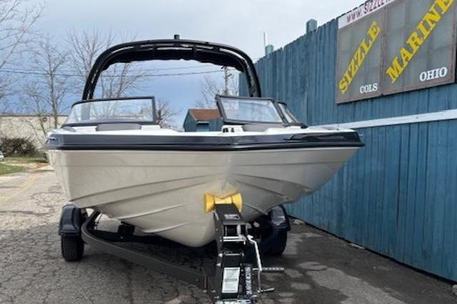 2026 Yamaha Boats AR190 on trailer, parked near blue fence at Sizzle Marine.