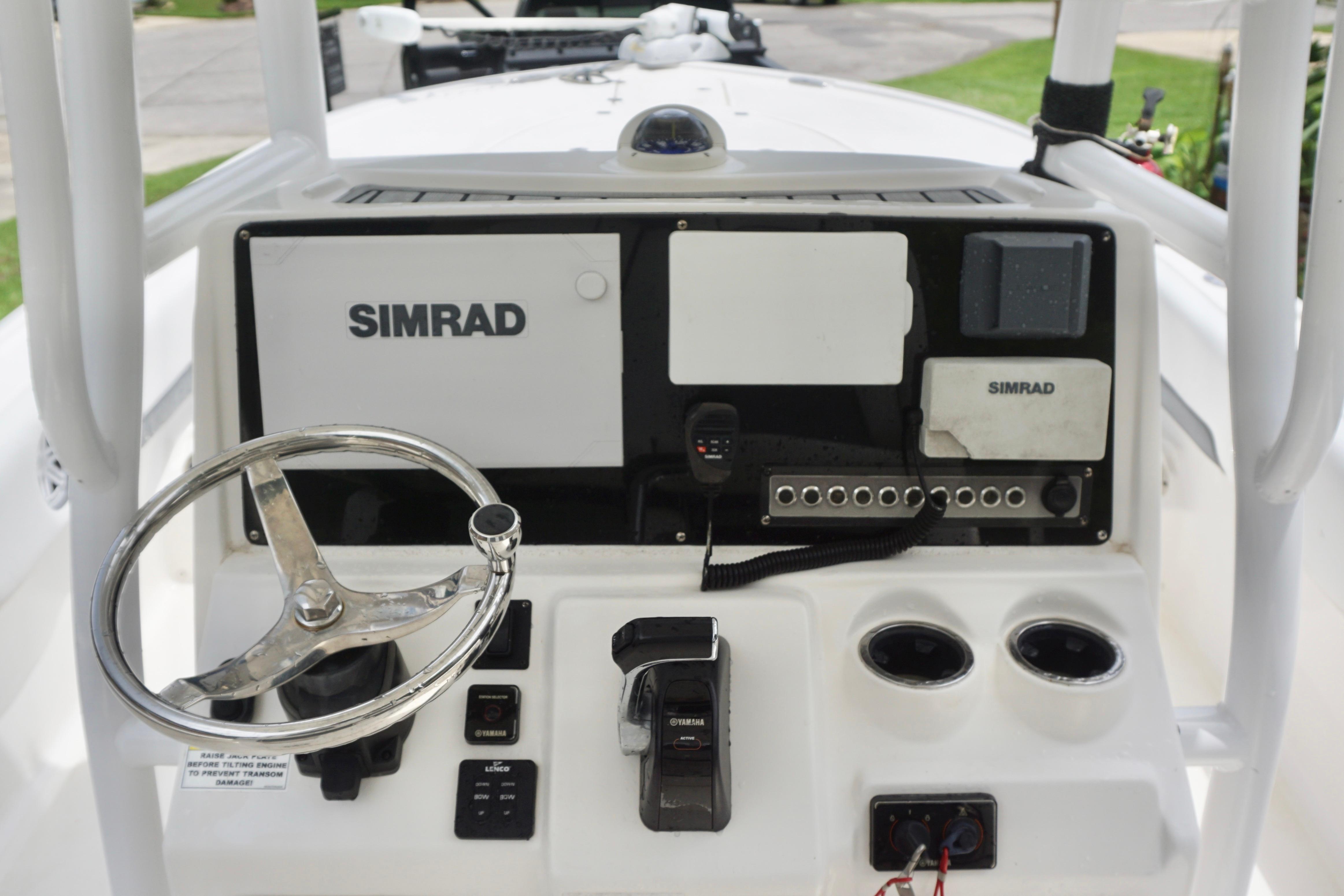 2019 Tidewater 2700 Carolina Bay boat dashboard with Simrad electronics and steering wheel.