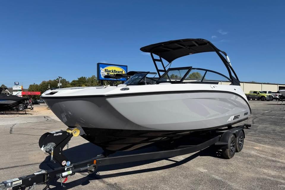 2026 Yamaha AR250 boat on trailer under clear blue sky.