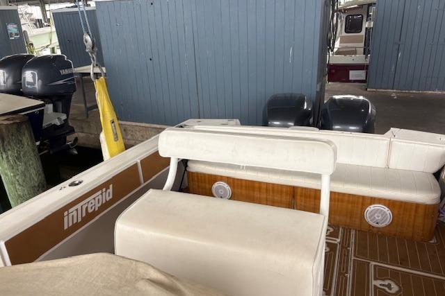 2006 Intrepid 310 Walkaround boat interior with seating and storage compartments.