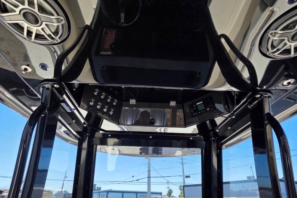Interior view of 2024 Blackwood 290 boat with speakers and control panel.