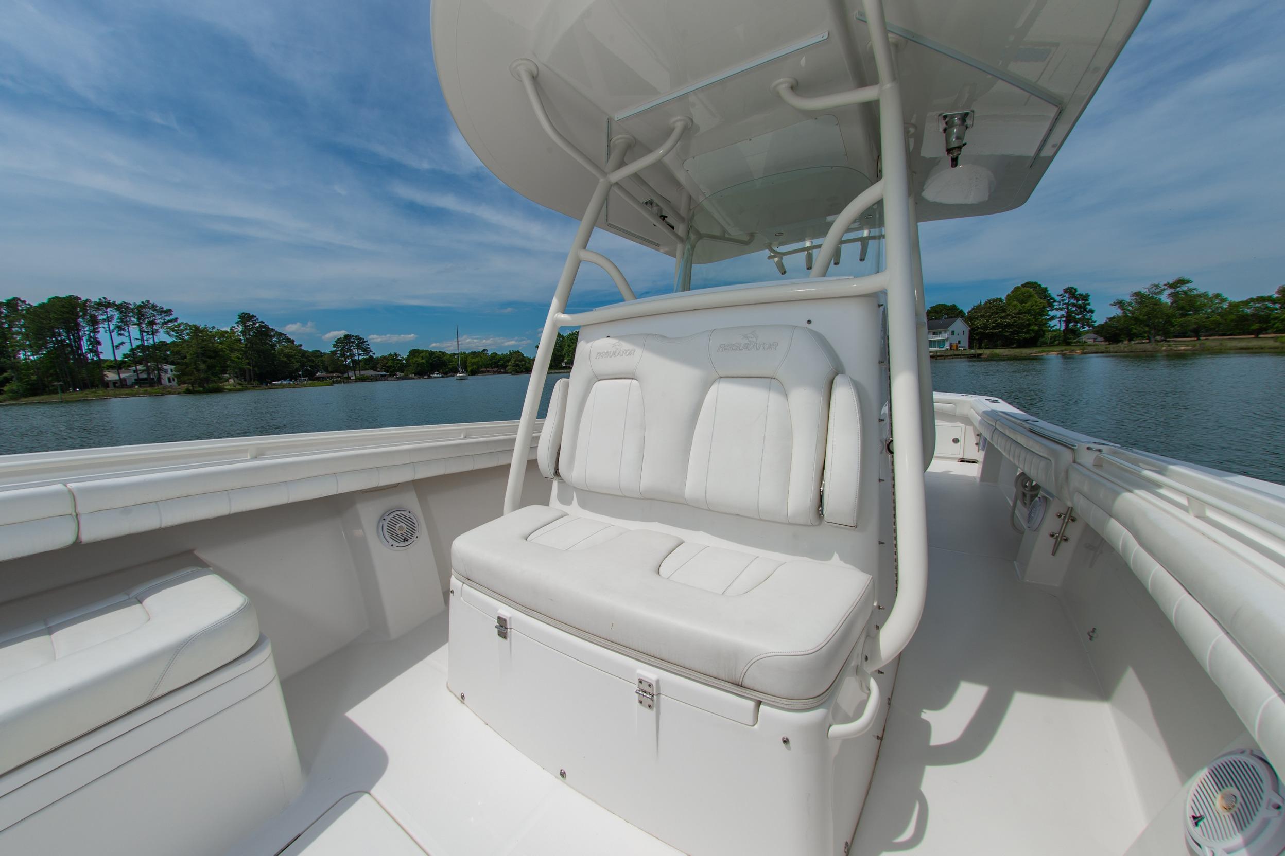 2019 Regulator 31 boat interior with white seating, under a clear blue sky.