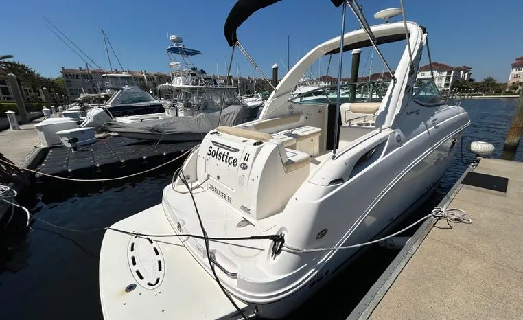 2010 Sea Ray Sundancer 260 boat docked at marina.