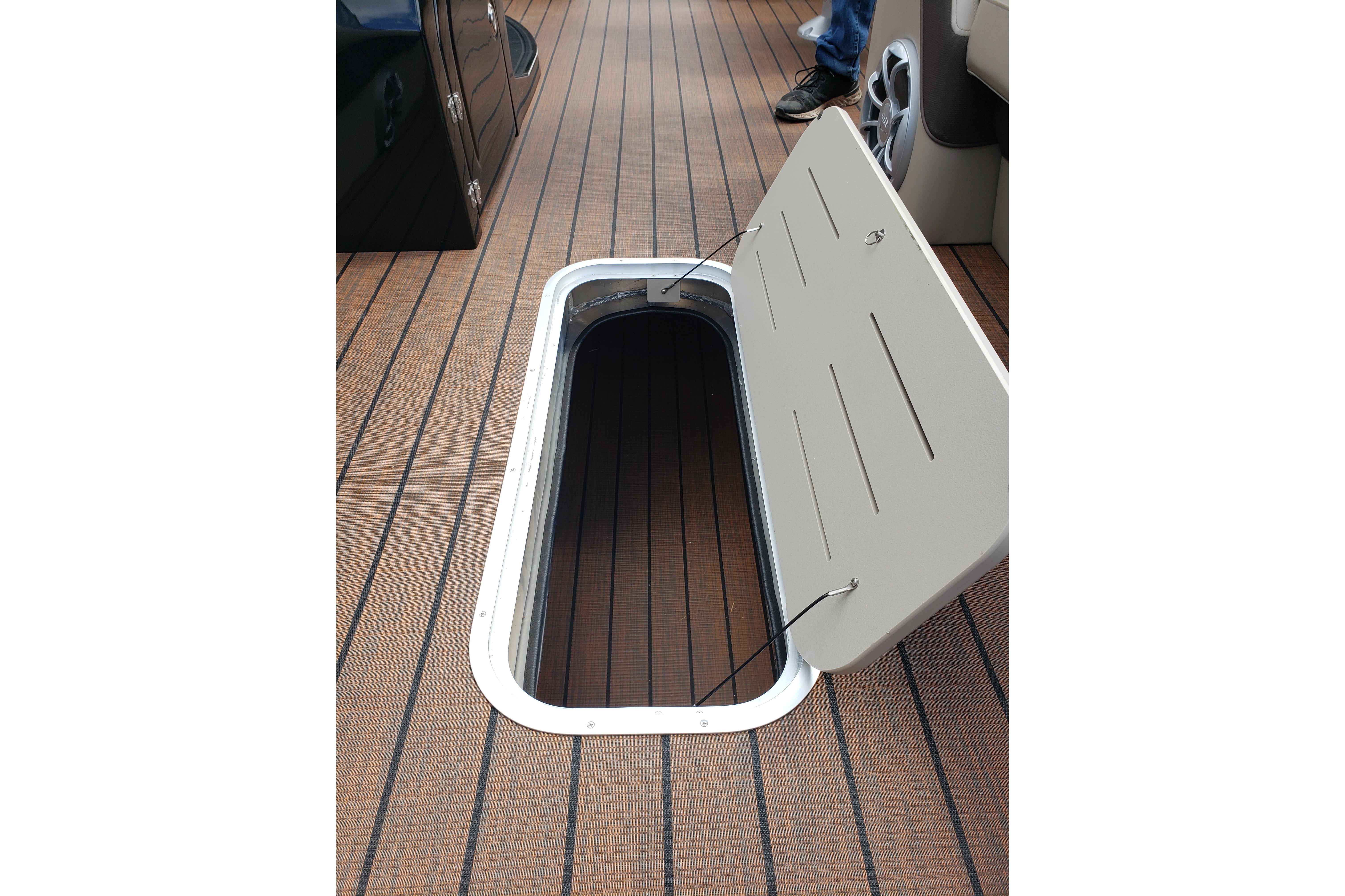 Open storage compartment on 2026 Bentley Pontoons Elite 253 QSB boat deck.