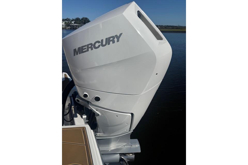 2025 Monterey Elite 27 OB with Mercury outboard engine on water.