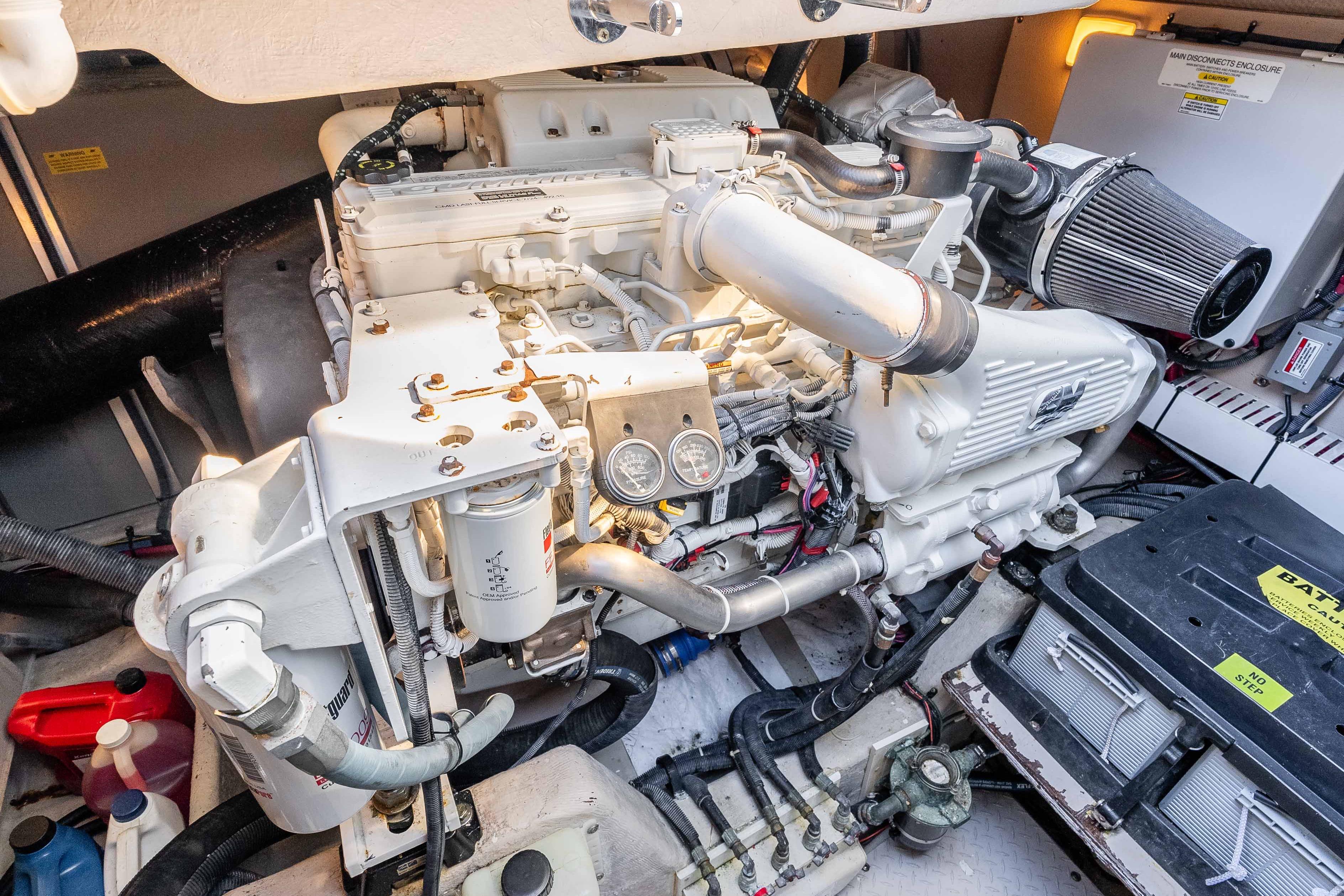 Engine room of 2007 Sea Ray 48 Sundancer yacht, showcasing detailed mechanical components.