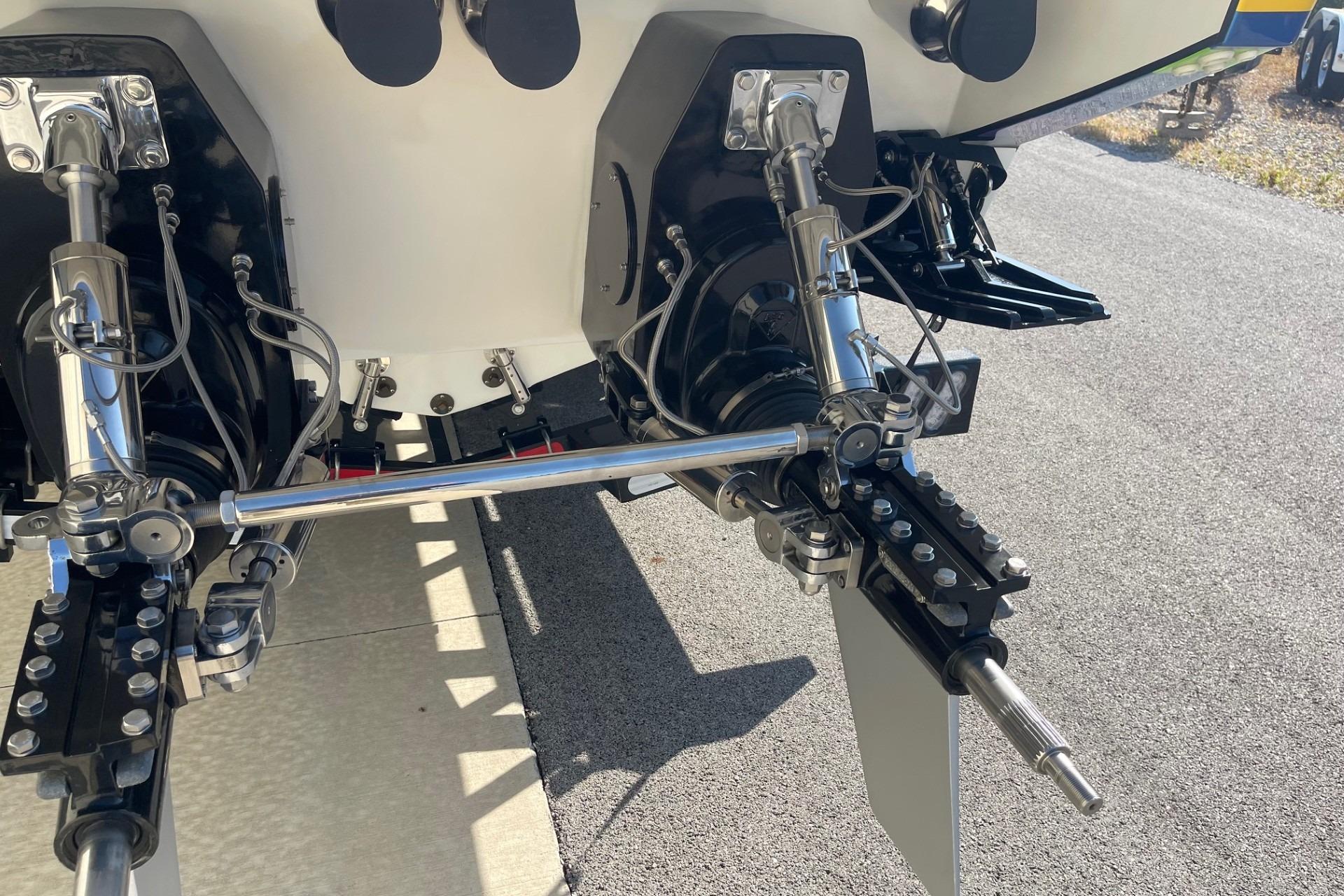 Rear view of 2004 Formula 382 FASTech boat's dual outdrive system on pavement.
