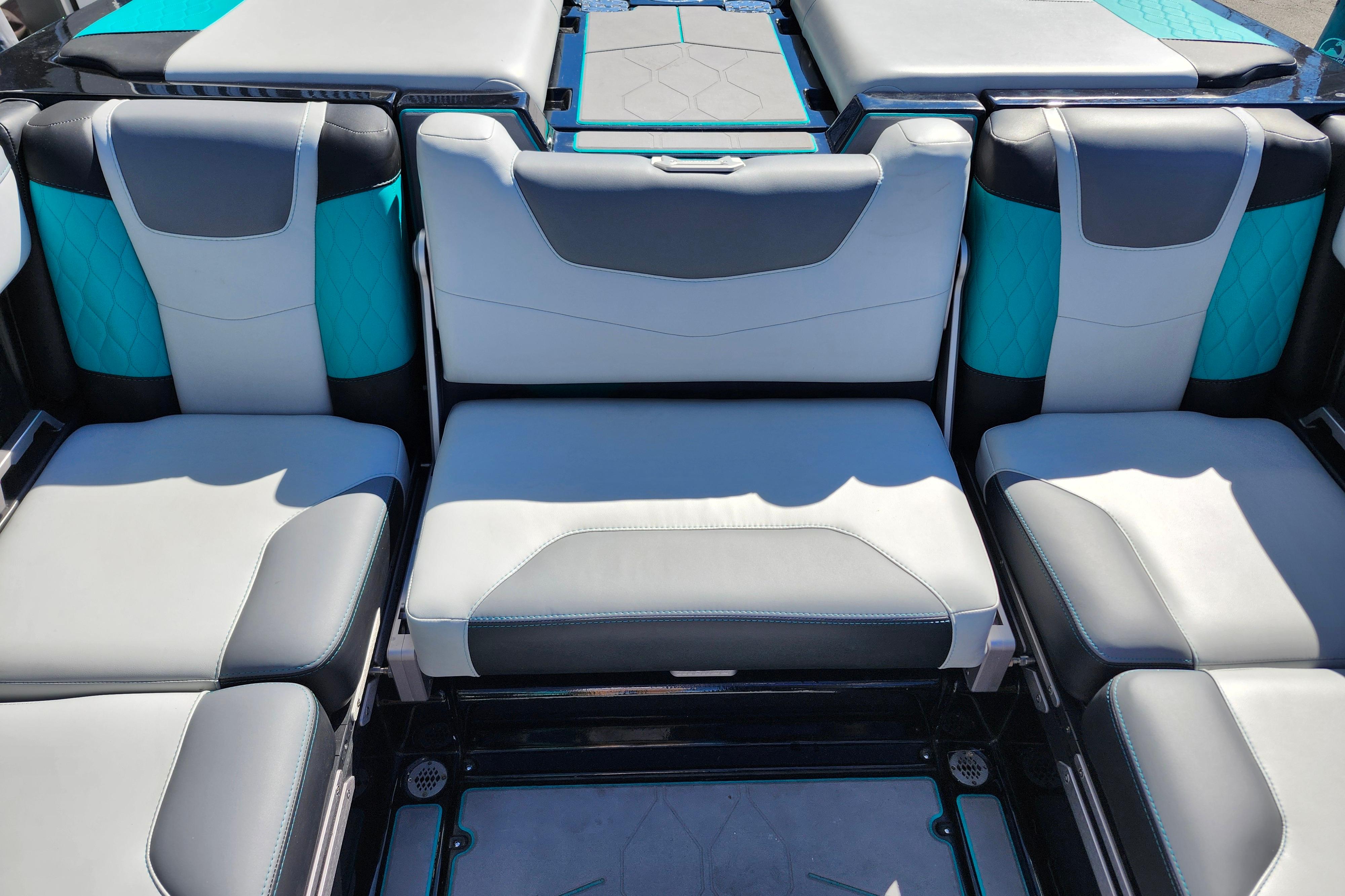 2022 Malibu M220 boat interior with stylish gray and teal seating.