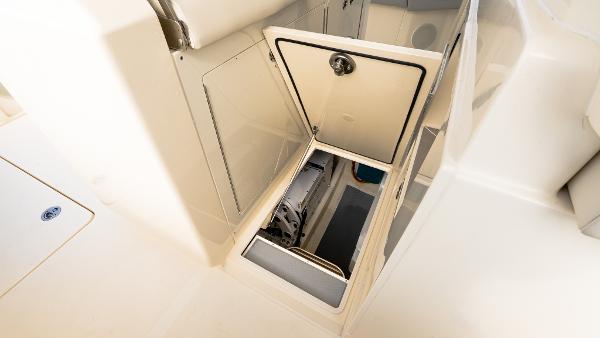 2025 Scout 425 LXF boat storage compartment with open hatch, showcasing interior space.