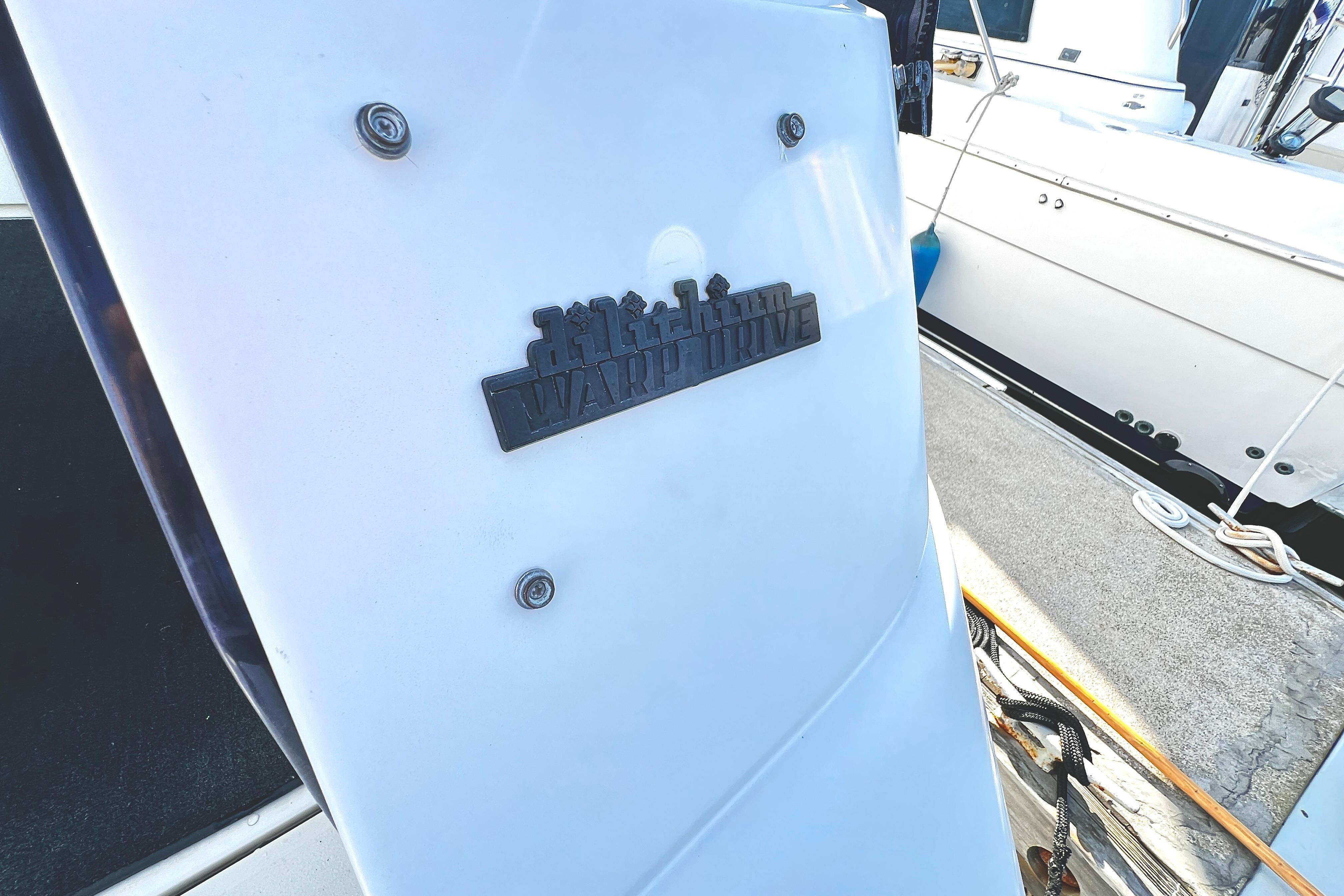 1989 Cruisers Yachts 3670 Esprit docked, featuring "Warp Drive" emblem.