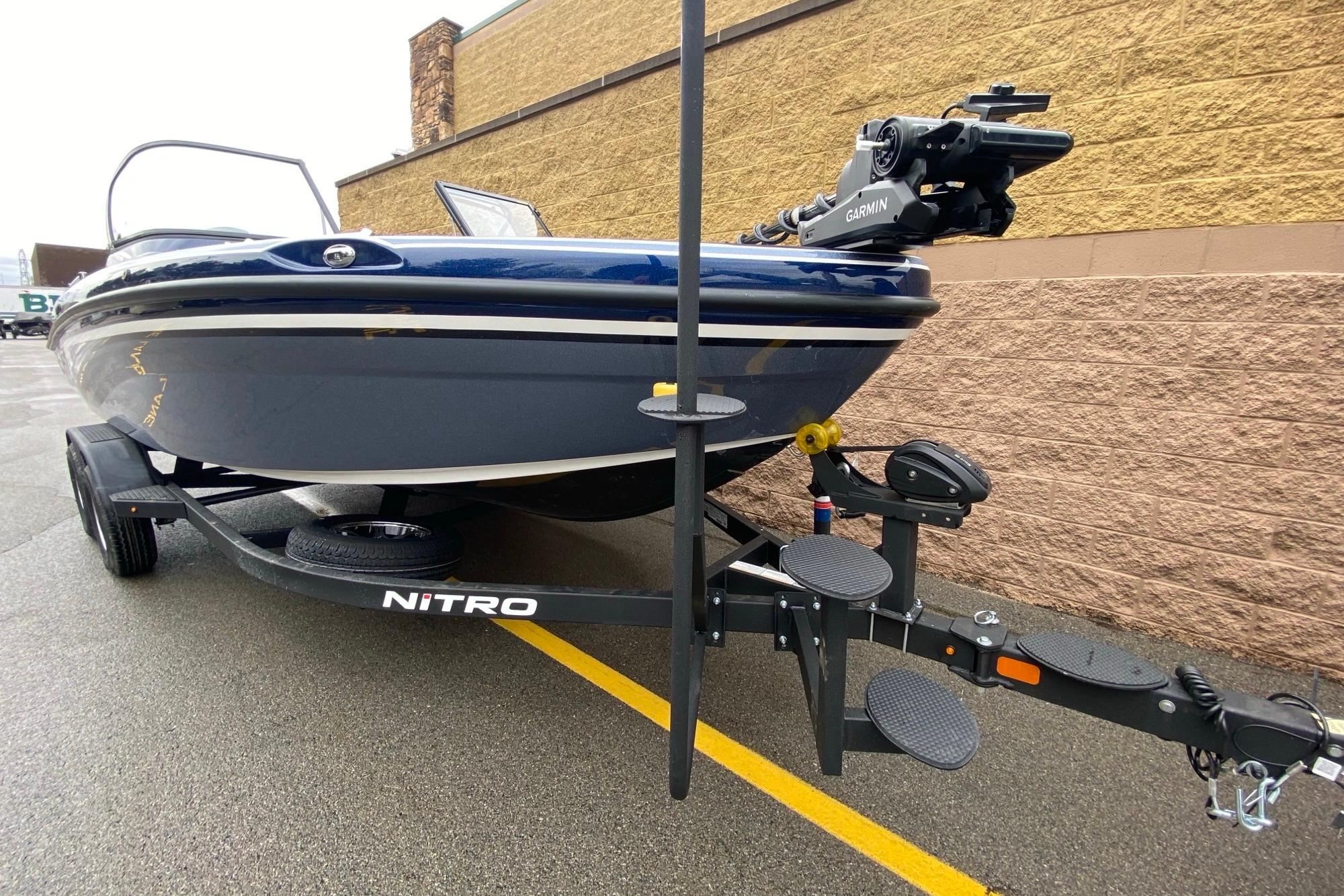 2026 Nitro ZV19 Pro boat on trailer, featuring Garmin equipment, parked outdoors.