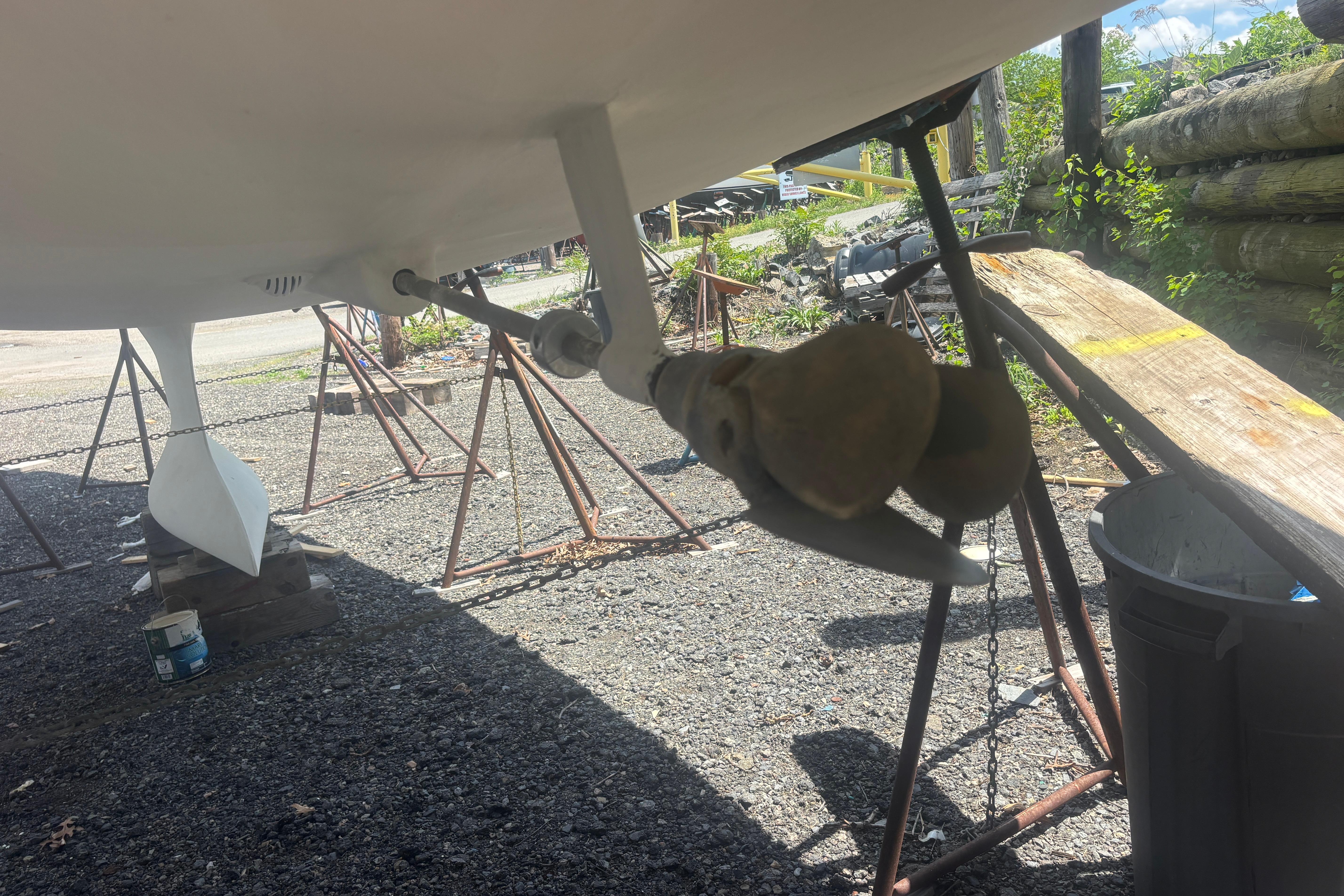 2021 Beneteau Oceanis 30.1 sailboat under maintenance, showing propeller and hull details.