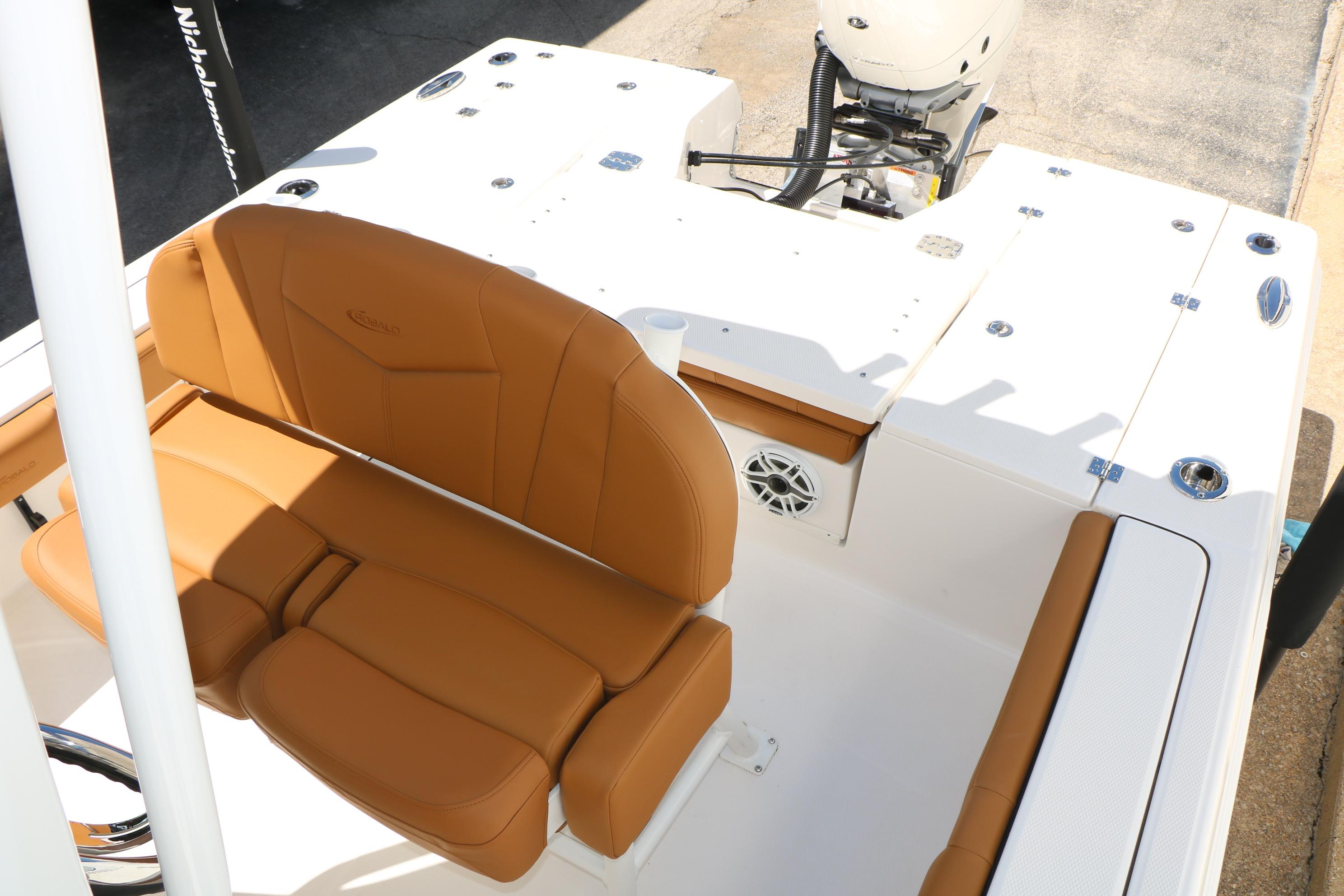 2026 Robalo 246 Cayman boat interior with tan seating and white deck.