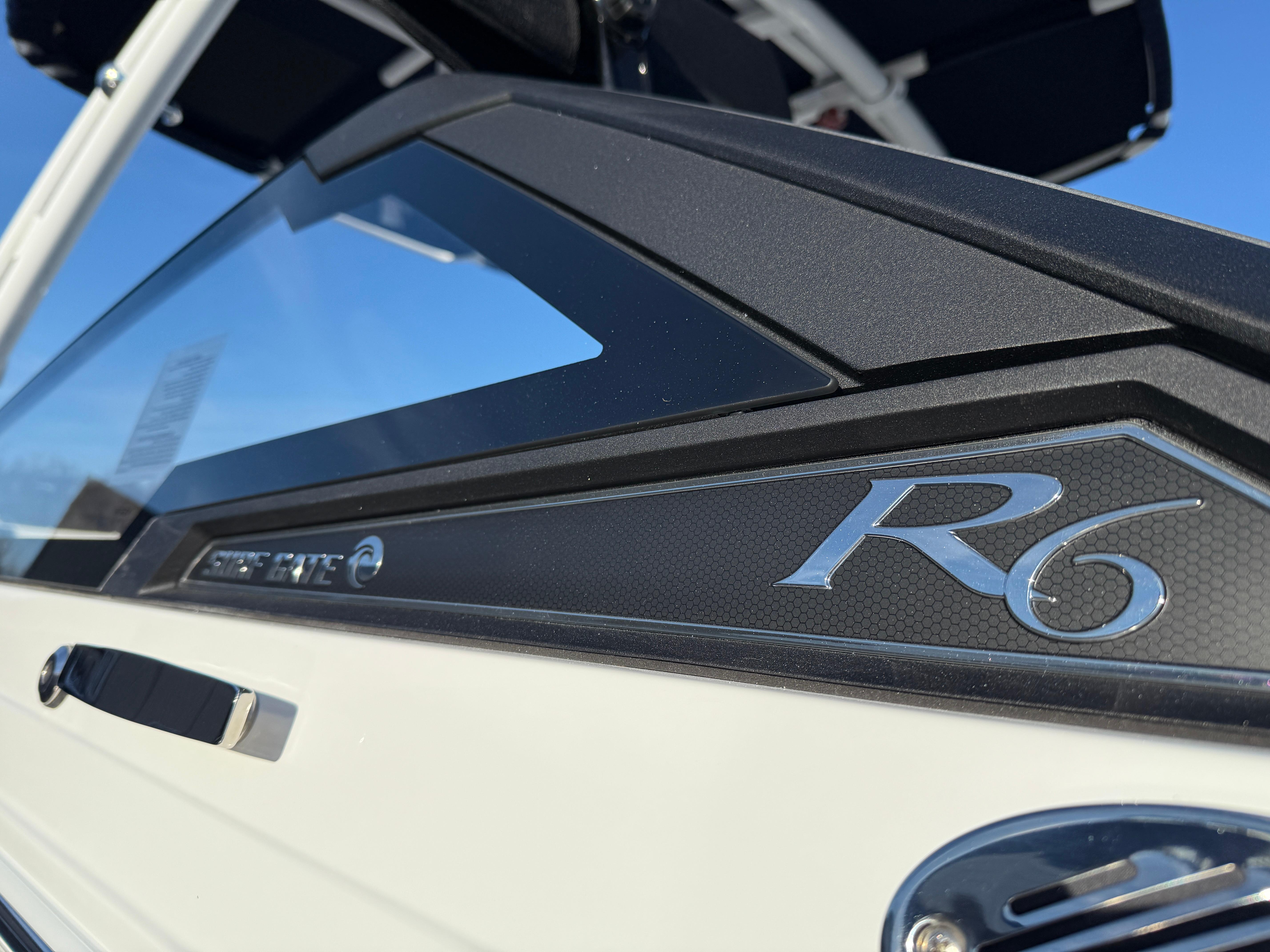 2025 Cobalt R6 Surf boat, sleek design with modern detailing, close-up view.