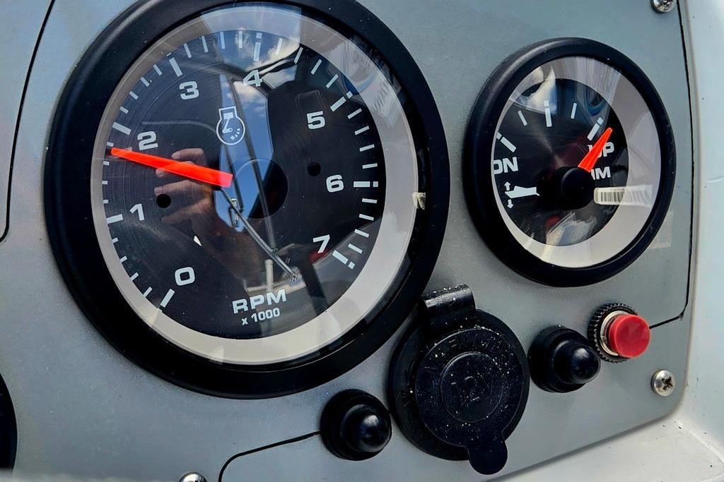 Close-up of 2018 Tahoe 450 TS dashboard gauges, showing RPM and temperature indicators.
