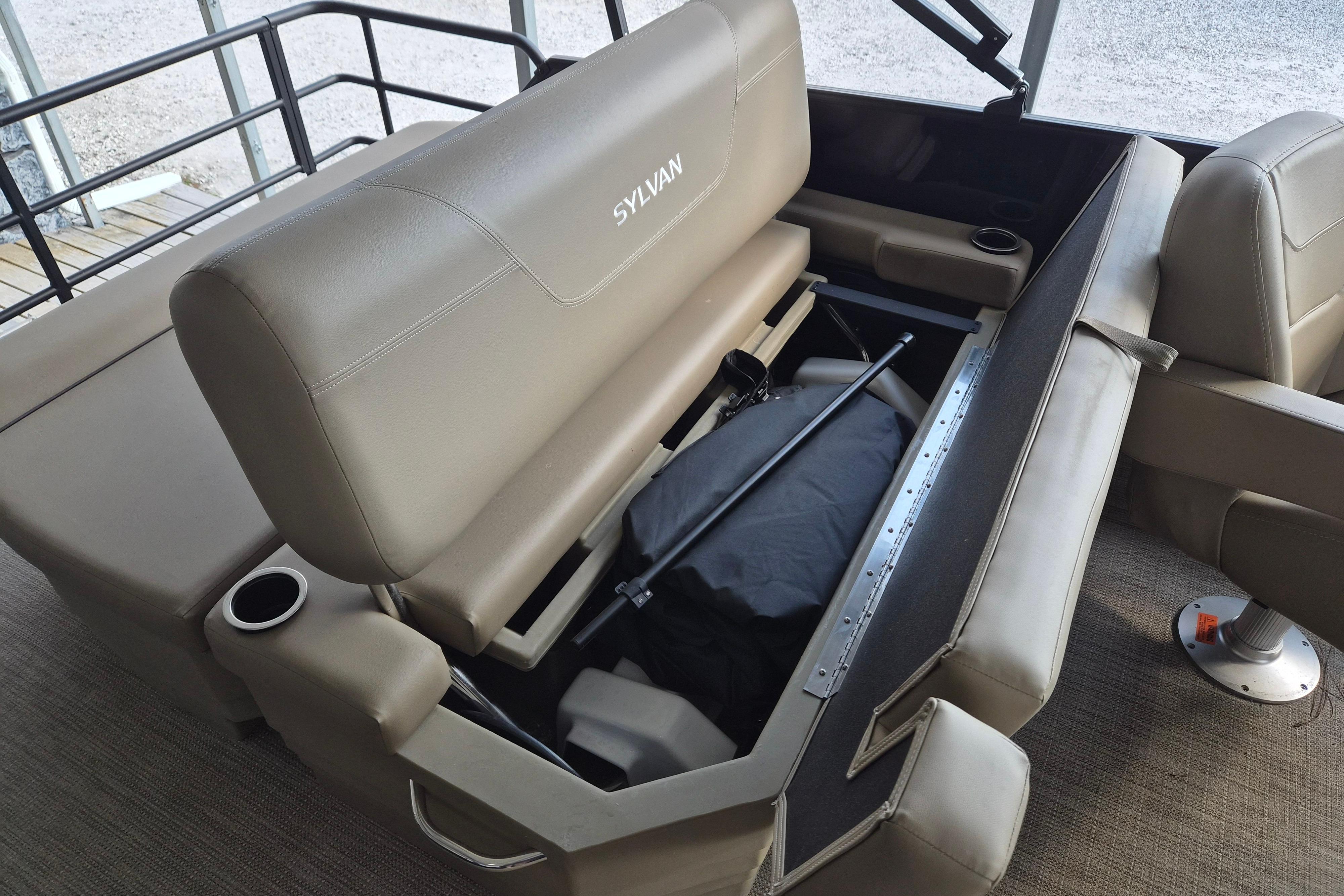 2026 Sylvan Mirage 820 CLZ DH boat interior with open storage compartment.
