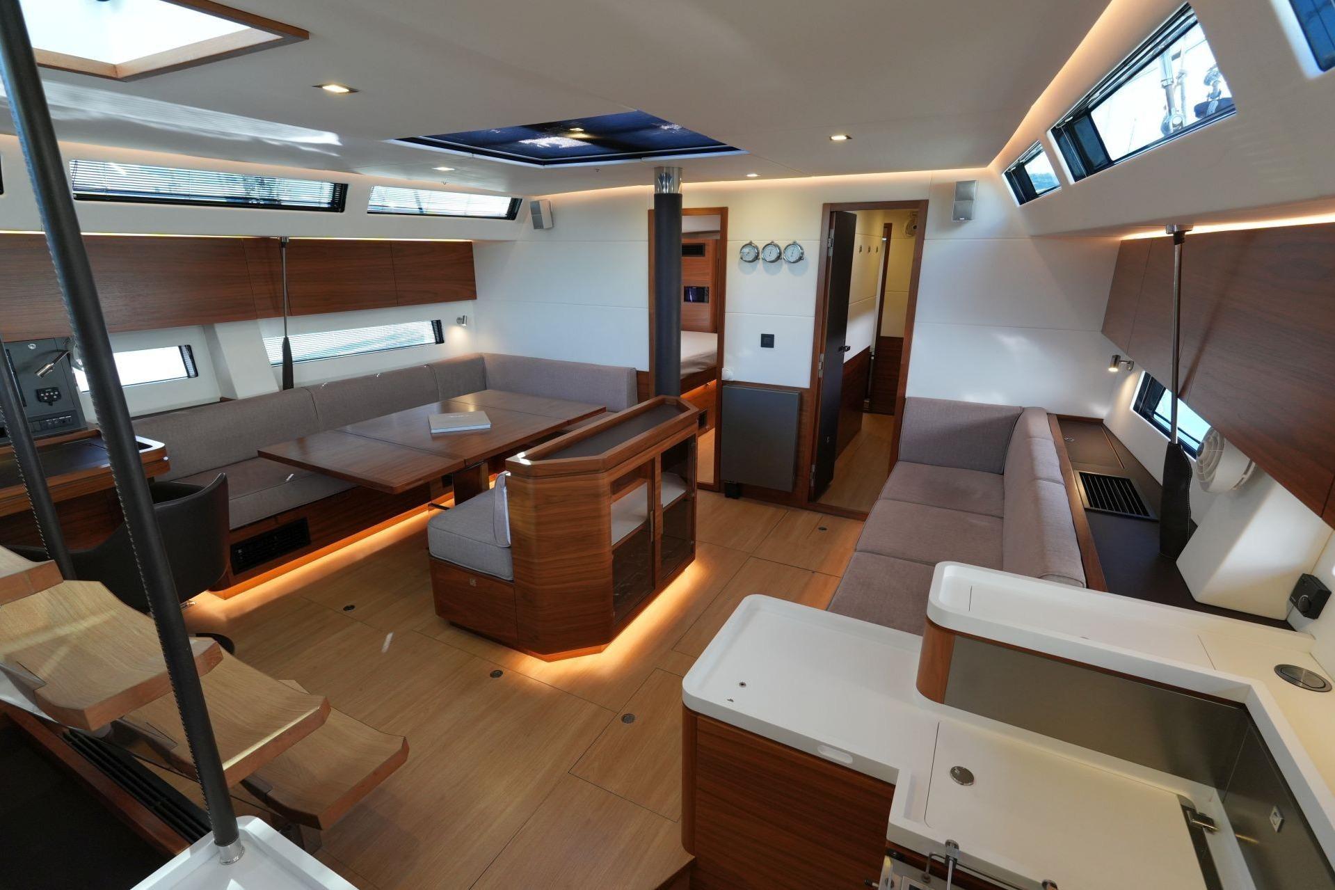 Luxurious interior of 2020 Amel 60 yacht with modern design and spacious seating.