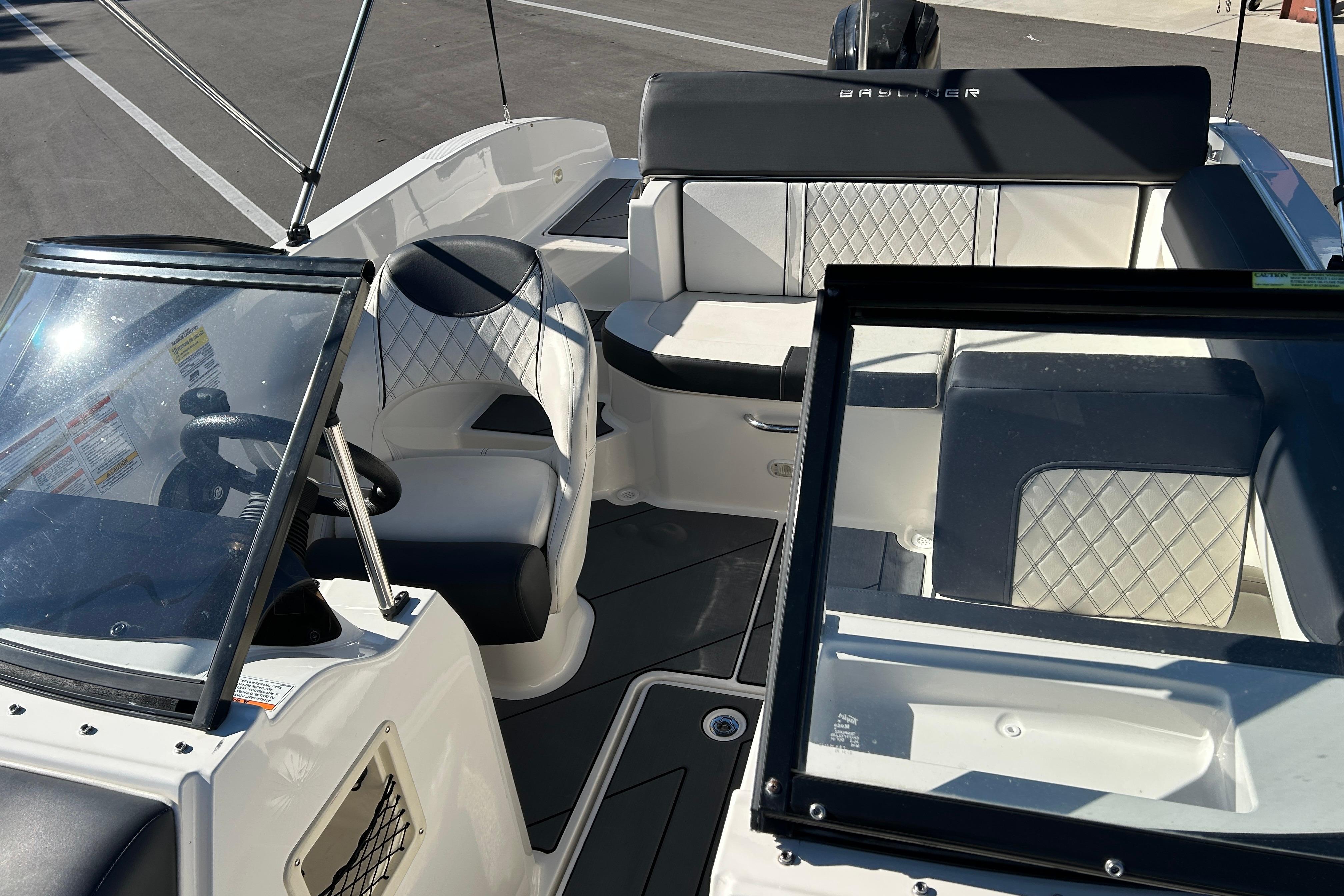 2020 Bayliner DX 2000 boat interior with seating and steering wheel.