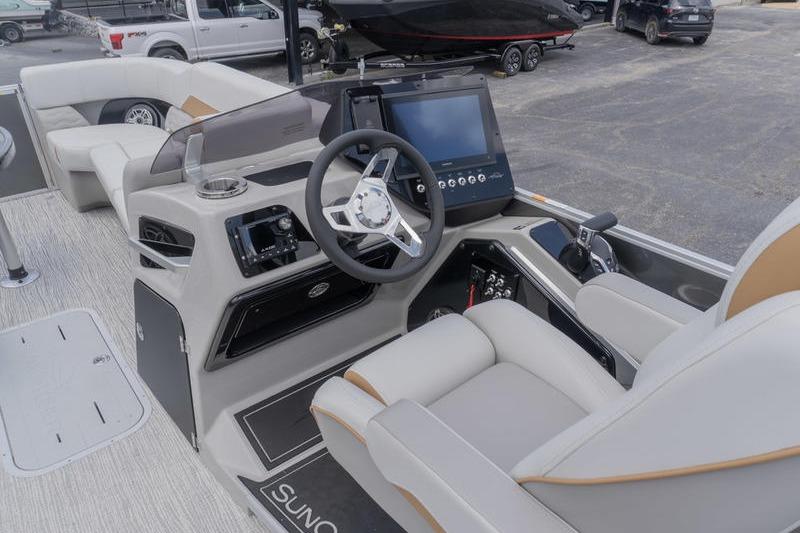 Interior view of 2026 SunCatcher Elite 326 SS boat with modern steering and seating.