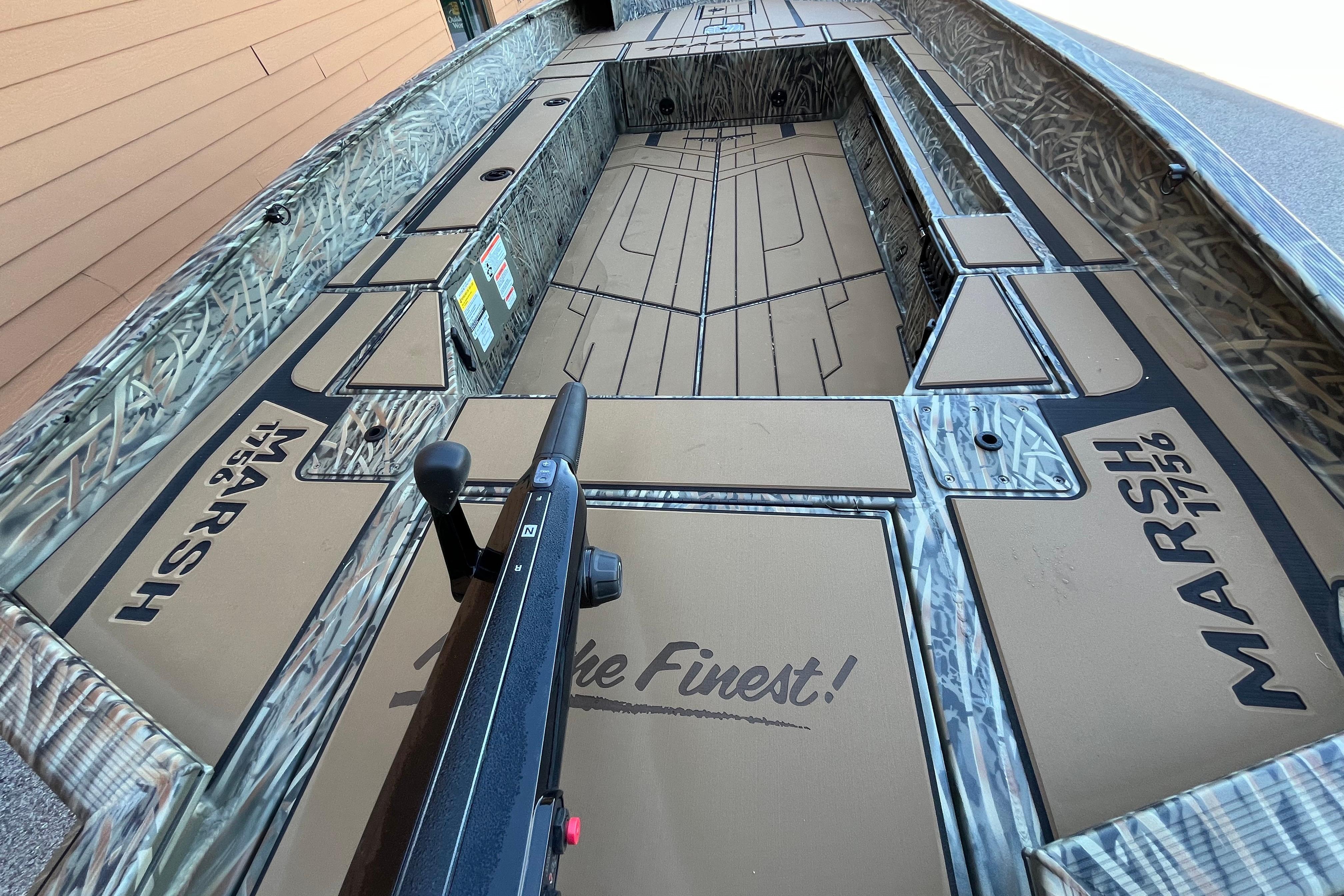 2026 Tracker Grizzly 1756 T Marsh boat interior with camo design and "Marsh 1756" branding.