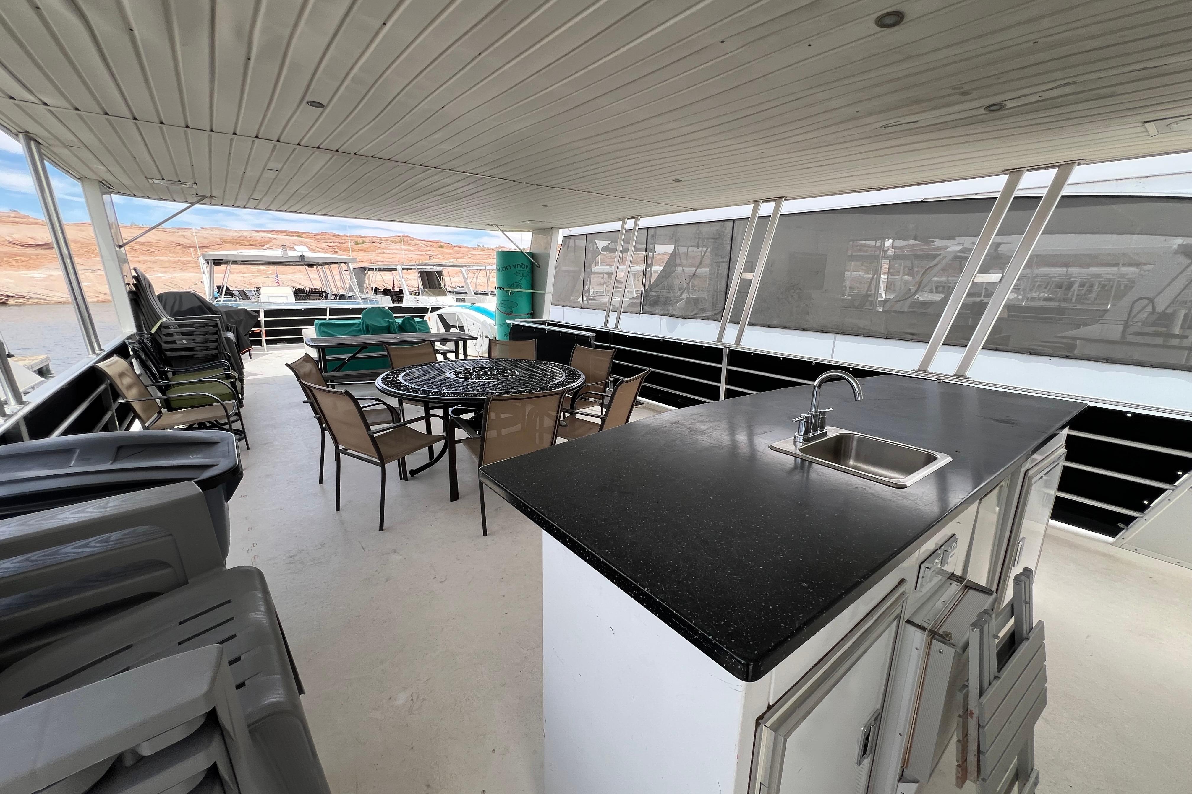Spacious deck of 2013 Destination Yacht Lotta Yachta with seating and kitchenette.