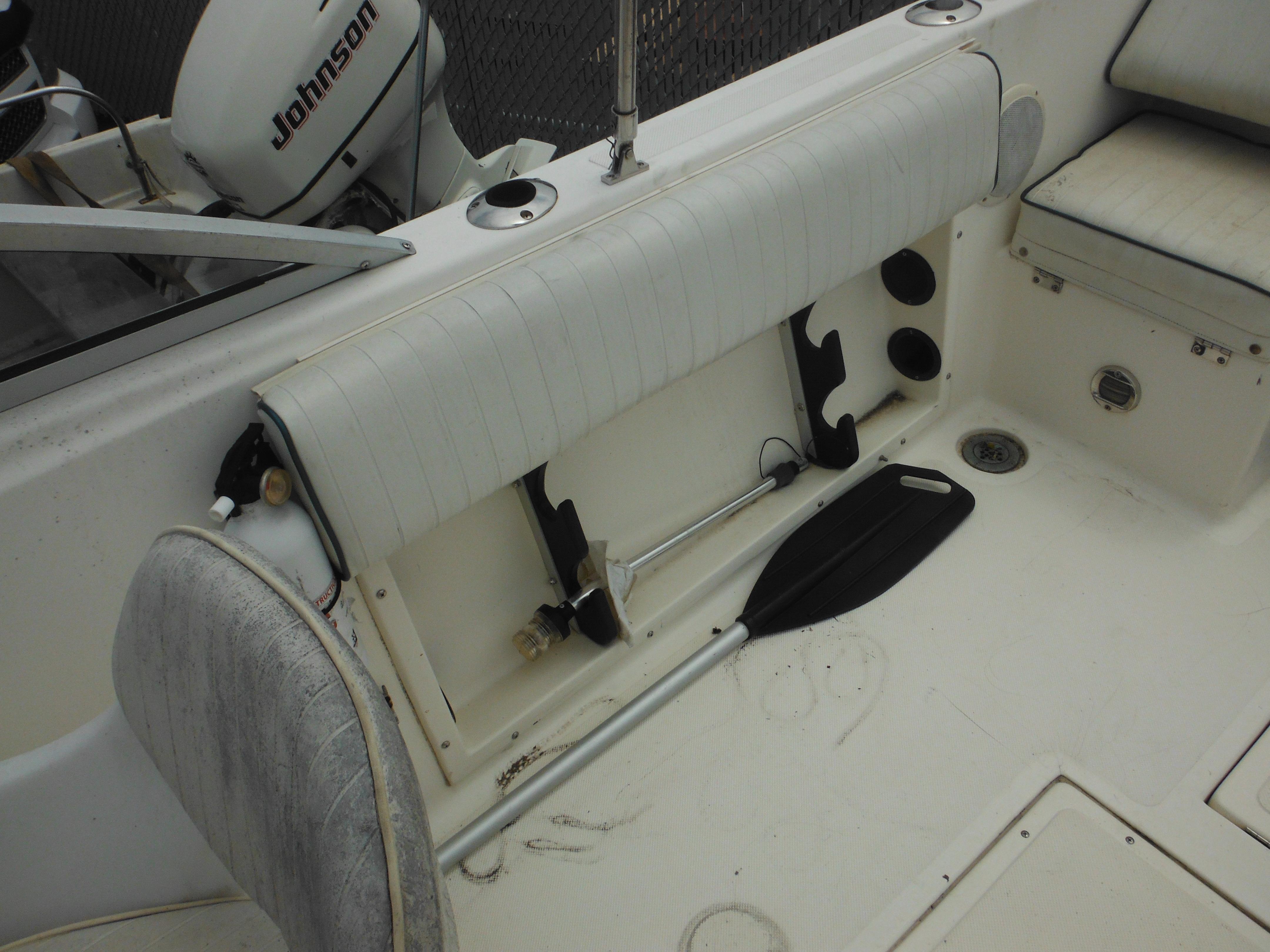 1996 Hydra-Sports 2000 DC boat interior with Johnson outboard motor and seating.