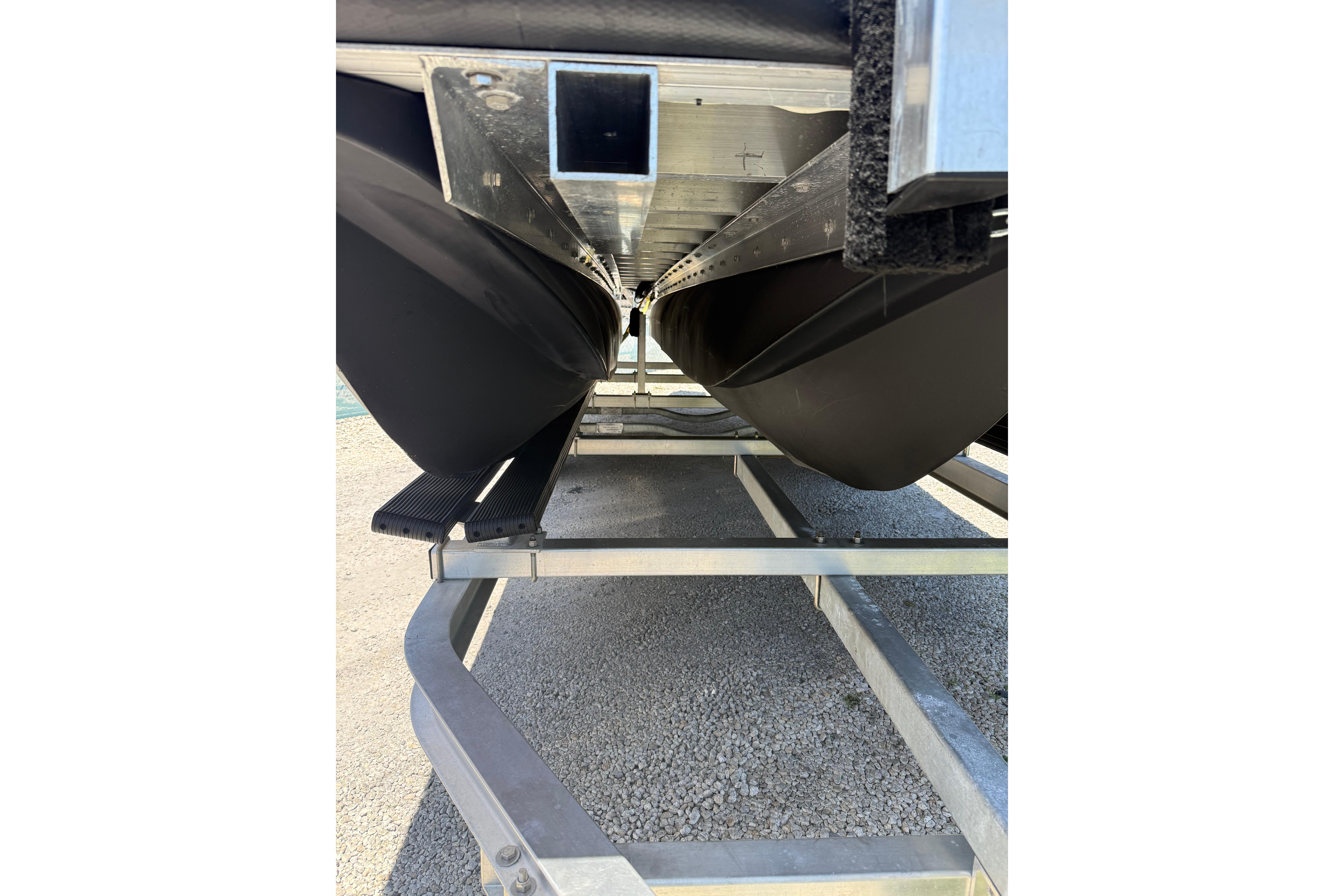 Underneath view of a 2026 Tough 20 boat on a trailer.