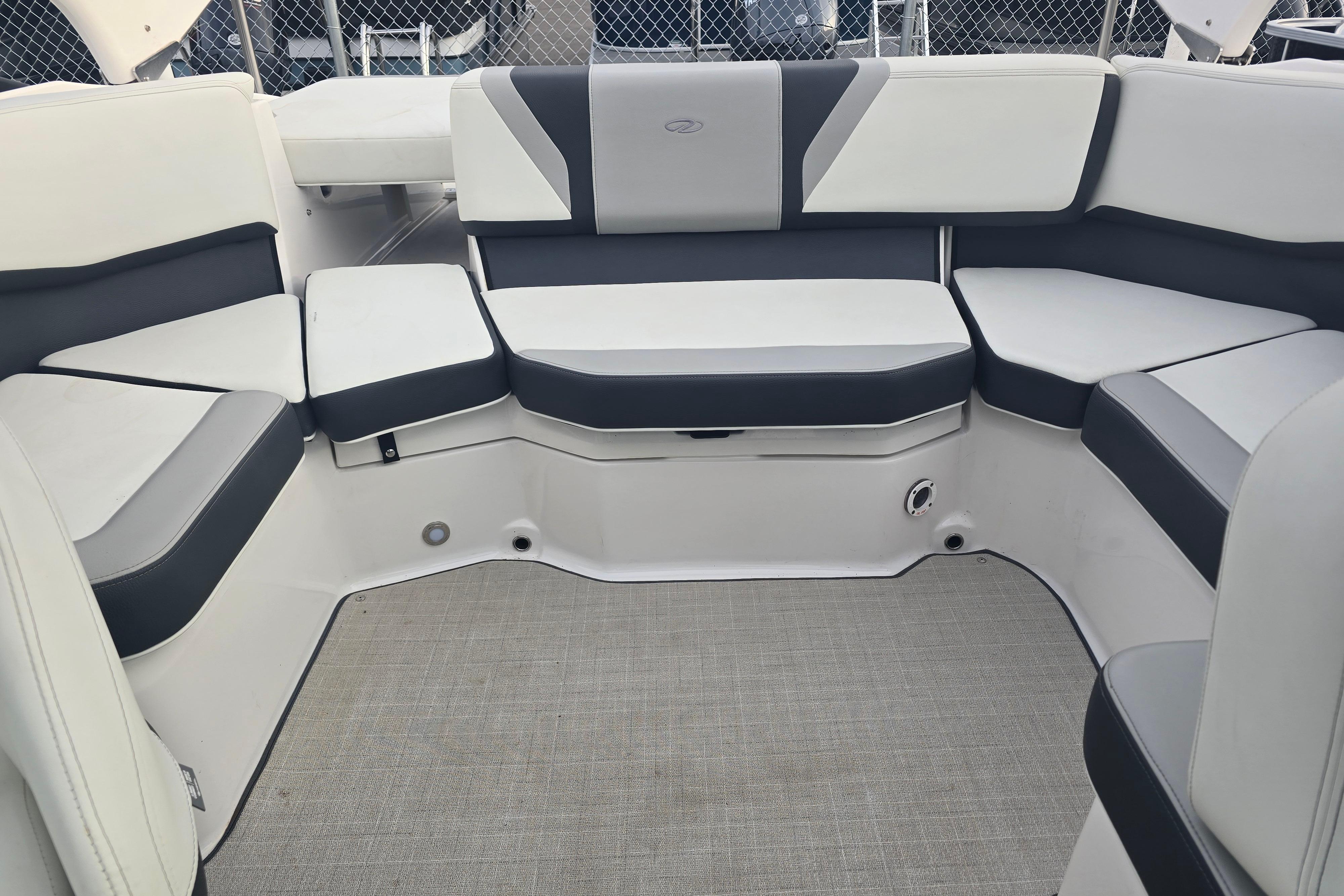 Interior seating of 2022 Regal 2000 ES boat, featuring white and gray upholstery.