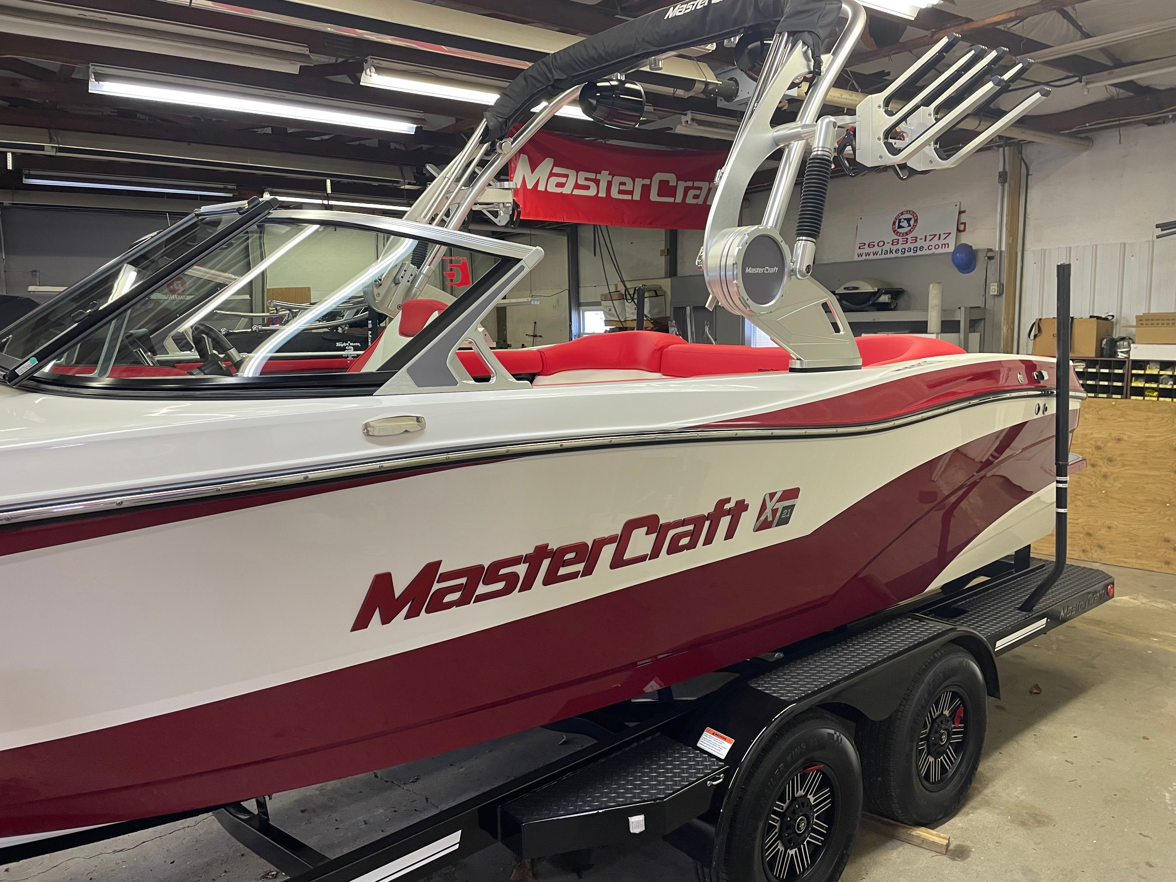 2019 Master XT21 boat in a workshop, red and white design.