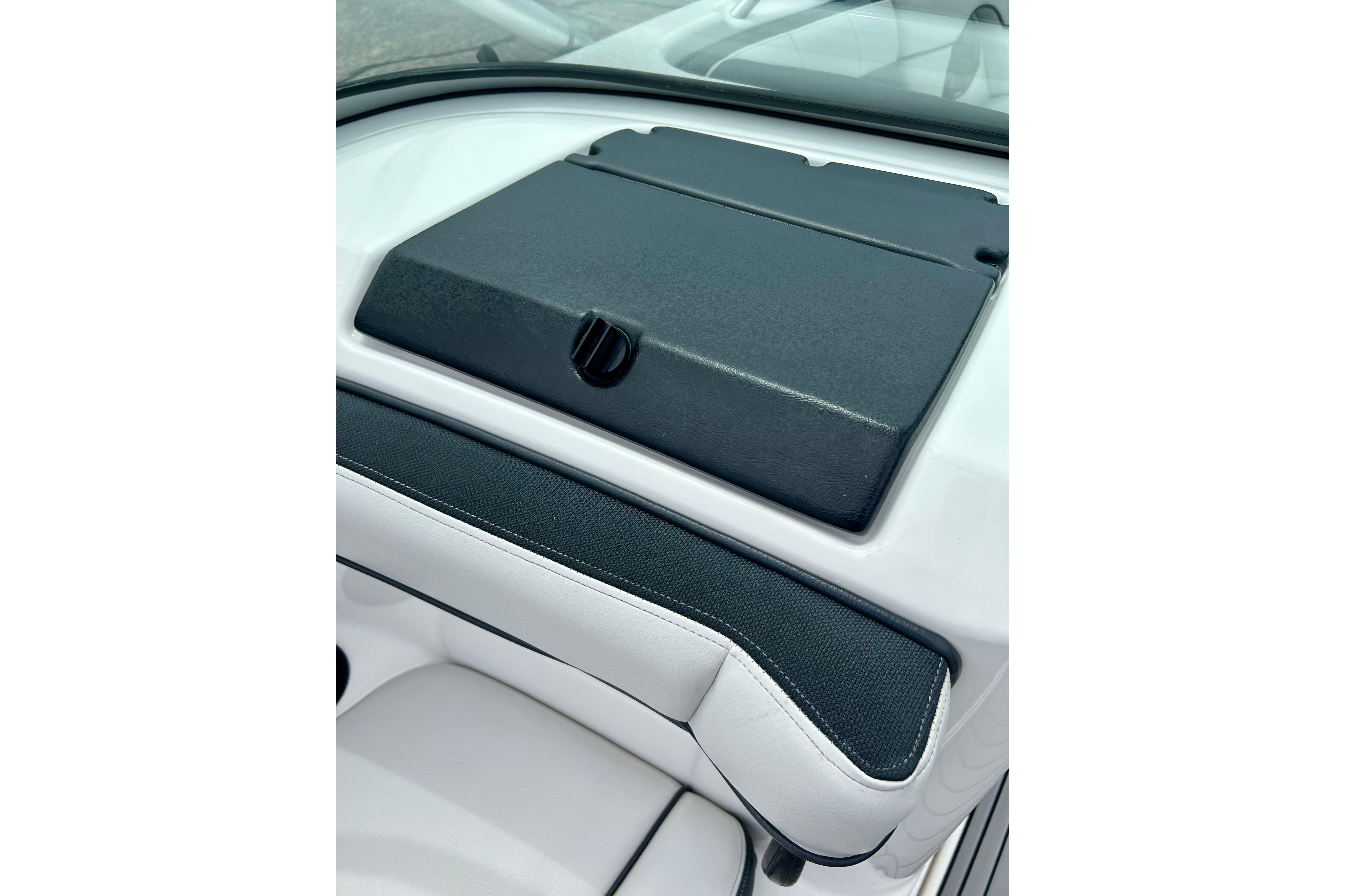 2015 Yamaha AR210 boat dashboard with black cover and white seating detail.