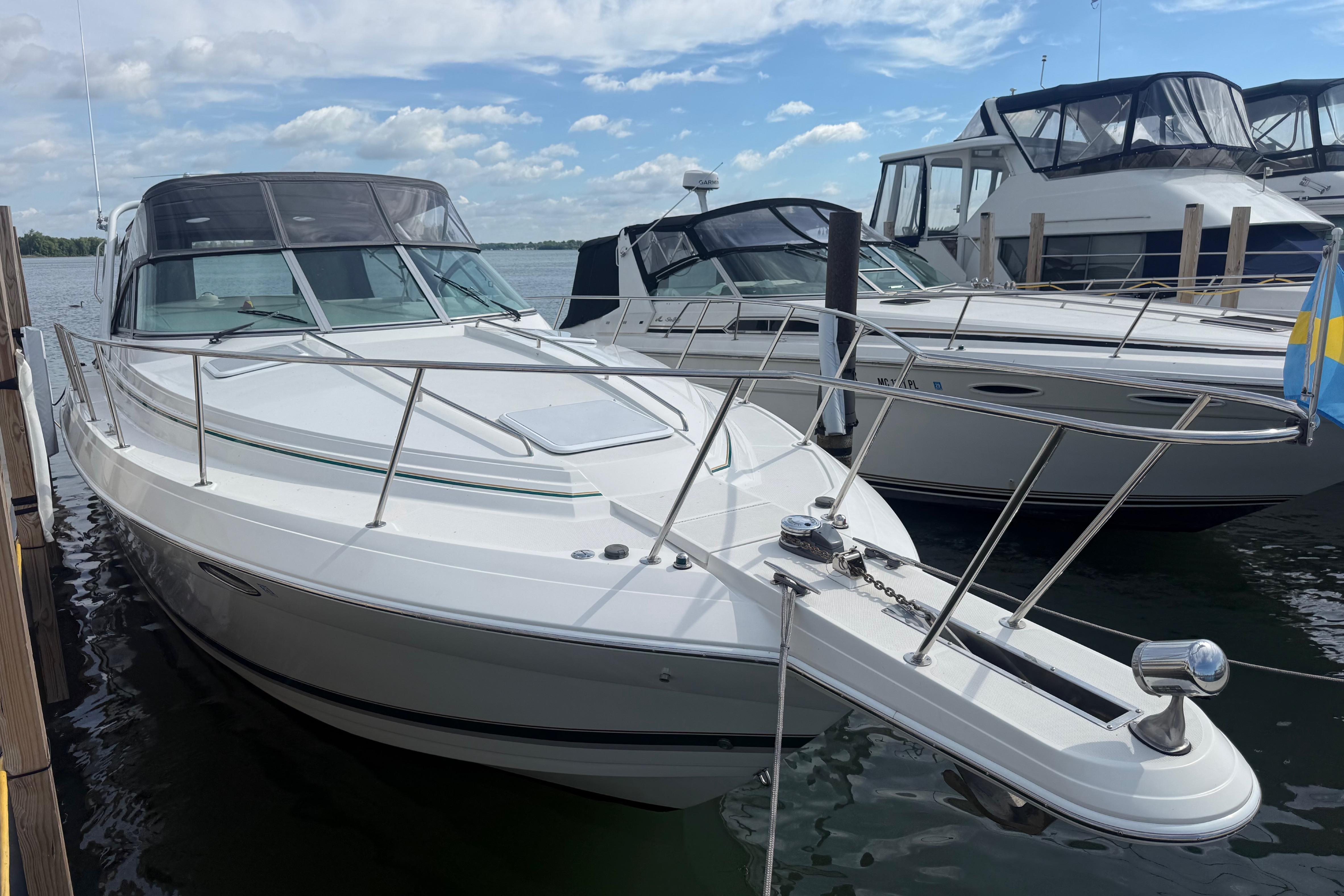 1999 Formula 34 Performance Cruiser docked, showcasing sleek design and spacious deck.