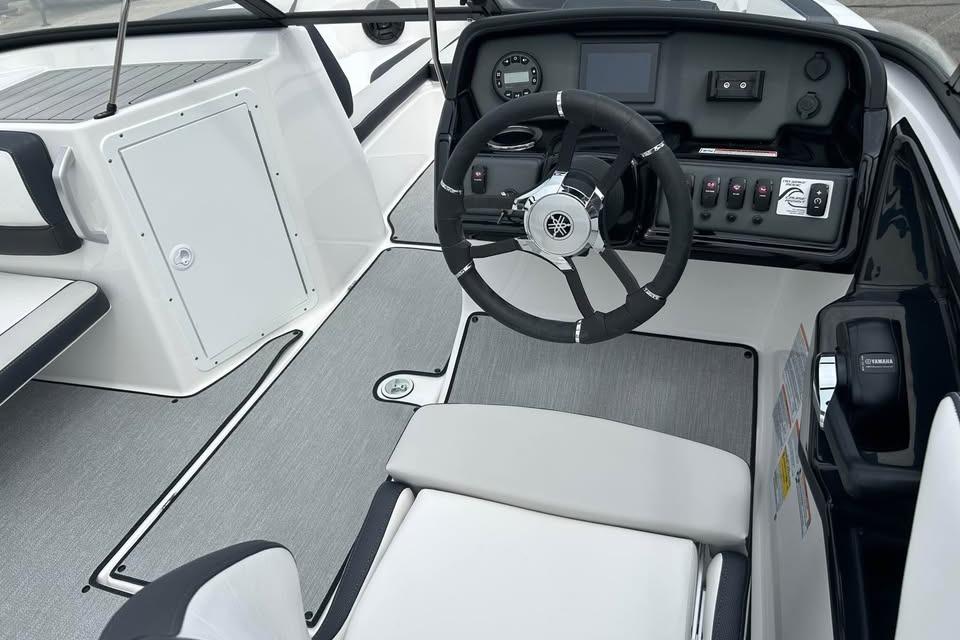 2026 Yamaha Boats AR195 cockpit with steering wheel and control panel.