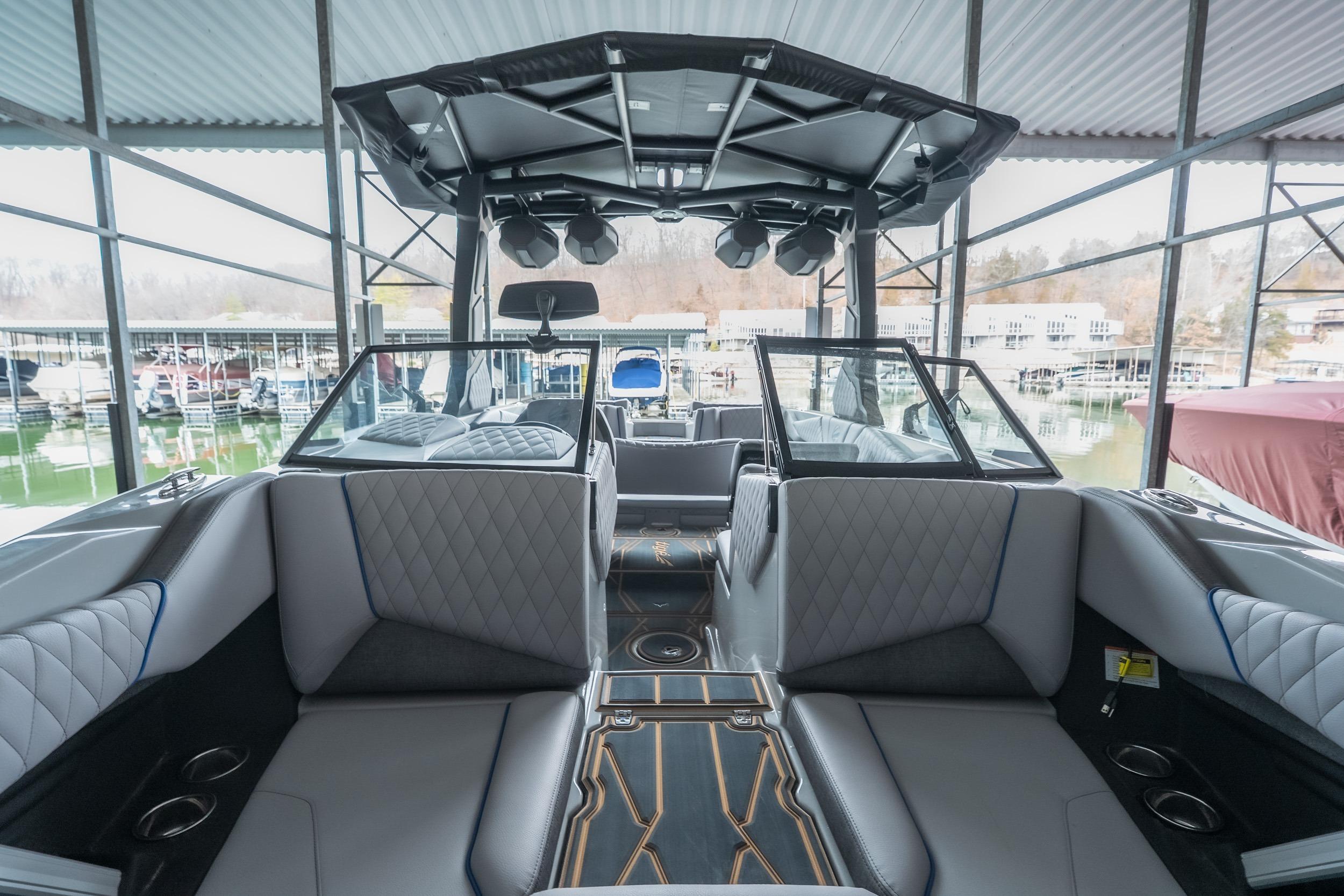 2026 Tigé Z3 boat interior with modern seating and sleek design in a marina setting.