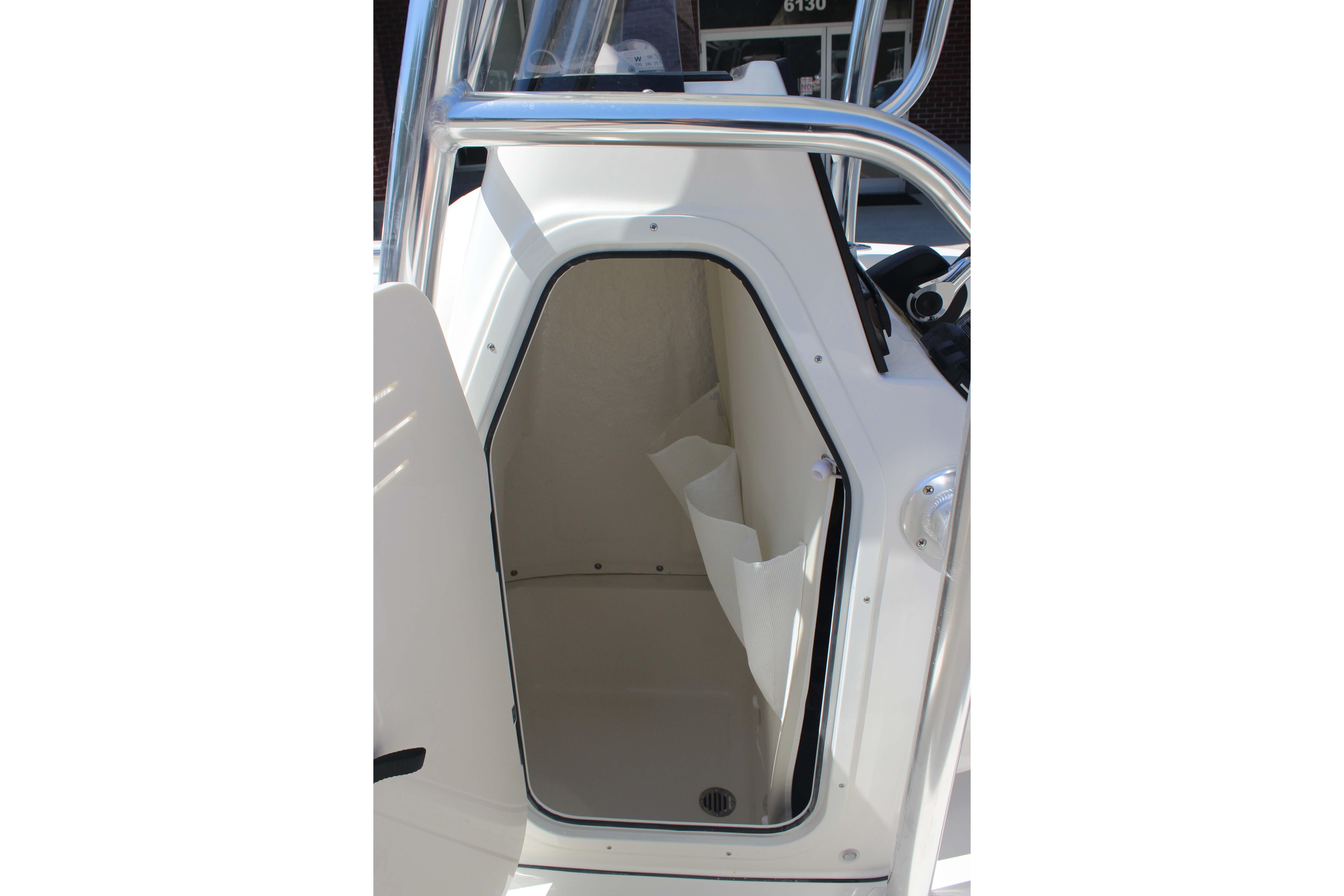 Interior view of 2026 Key West 203 FS boat cabin, showcasing compact design.