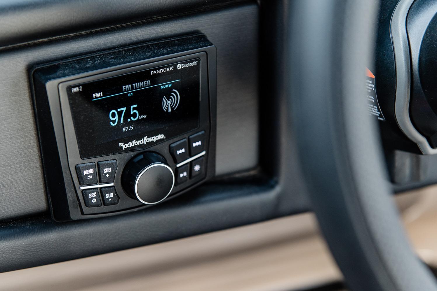 2025 Bentley Pontoons Elite 253 QSB stereo system displaying FM tuner at 97.5 MHz.